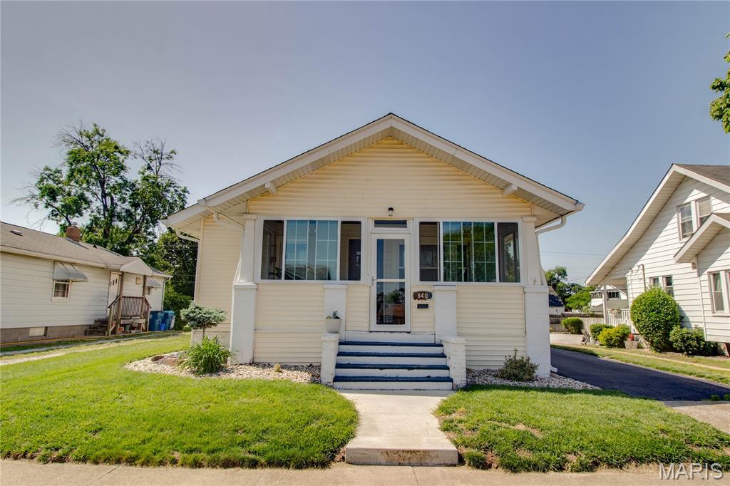 Step into comfort and convenience with this beautifully updated 2-bedroom, 1-bath home in Wood River offering the perfect blend of charm and modern improvements. There is an adorable enclosed front porch allowing for additional living space that brings the outside, in. A number of major updates have been completed within the last two years, including new flooring, updated electrical, new waterline and plumbing, plus a refreshed kitchen and bathroom designed with today’s buyer in mind. The bathroom features a relaxing Jacuzzi tub, while tall ceilings throughout the home create an airy, inviting feel. Enjoy the ease of main floor laundry and the bonus of additional living space downstairs featuring an office, nonconforming third bedroom, ample storage, sump pump, and a waterproof baseboard system for added peace of mind. Outside, you’ll love the fully fenced backyard, inviting patio area, and covered back porch with durable composite decking — perfect for relaxing or entertaining. A detached garage with opener completes this move-in ready property packed with value and updates. Agent is related to seller.