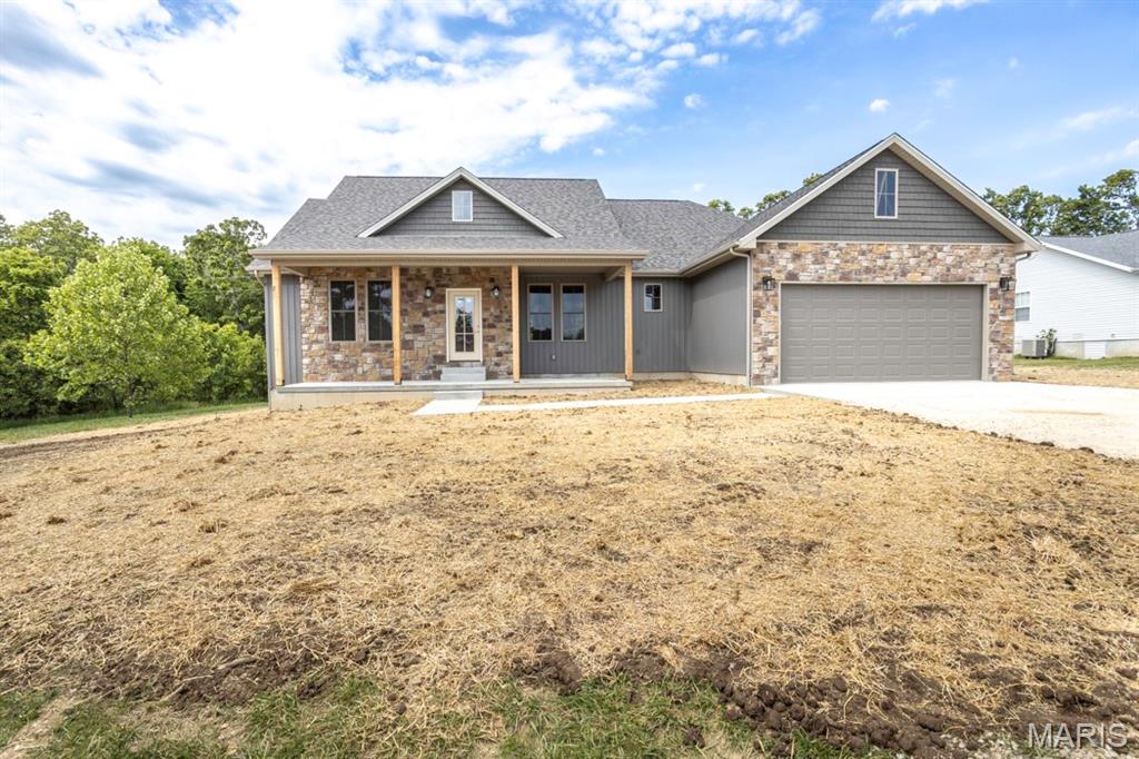 This brand new 4 bedroom, 2 bathroom home offers the perfect blend of modern style, comfort, and quality upgrades, all located in a highly desirable subdivision with a great yard to enjoy. Step inside to an inviting open layout featuring vaulted ceilings in the living room, 9-foot ceilings throughout the home, and a modern neutral color scheme that creates a bright and welcoming atmosphere. The spacious kitchen and living areas are ideal for both everyday living and entertaining. Outside, enjoy relaxing mornings on the covered front porch or evenings on the low-maintenance composite back deck. The primary suite is designed for comfort with double sink vanities, a relaxing soaker tub, and a large walk-in closet offering plenty of storage space. With thoughtful upgrades throughout and beautiful curb appeal, this home is move-in ready and built to impress. Completion date in about 30 days.