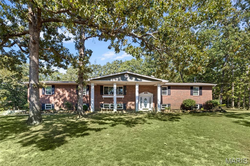 Welcome to a private retreat set on 12+- acres, where timeless craftsmanship meets thoughtful modern updates. Rich real-wood details throughout include hardwood flooring, crown molding, and a stunning custom wood-paneled state room crafted by a local cabinet company. The updated kitchen features beautiful silestone countertops and stainless steel appliances, while additional improvements include central air and energy-efficient windows. Outside, enjoy a large cleared lawn bordered by mature trees and natural surroundings, along with a screened-in porch and an expansive deck—perfect for relaxing, entertaining, and taking in the peaceful setting. A heated and cooled (40 X 30) workshop with a vehicle lift station adds exceptional versatility. This is a full Perfect Package!! Seller has meticulously maintained the home!!