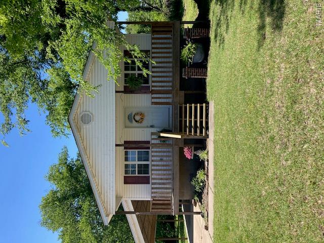 SELLER WILL PAY $1000 IN SELLER CONCESSIONS FOR A READY AND WILLING BUYER! Spruced up and ready for a NEW OWNER! Take a look at this nice, clean, move-in ready home sporting a NEW ROOF! The charming front porch leads to an open living, kitchen & dining area. Primary bedroom with 3/4 bath, two additional bedrooms, one full bath and a one car attached carport, a 12x24 storage shed with walk-in door and garage door. This is the perfect size for a starter home or someone ready to downsize. Come and see for yourself... adjacent lots are available if interested.