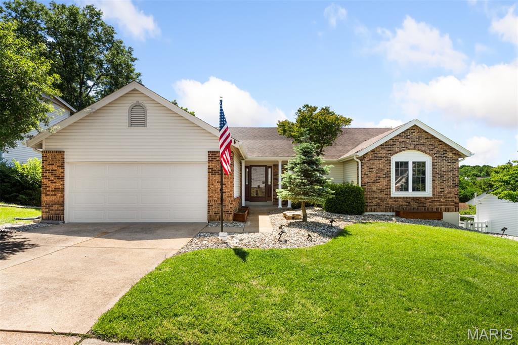 Welcome to this charming ranch home. You will have a welcoming sense of warmth and easy living when you step inside. As you enter to the right is a home office complete with book shelves all ready for you to use. The great room has an upgraded brick fireplace that is the focal point of the room and can keep your home cozy and warm all winter long with efficient log burning. The great room also features two skylights in the vaulted ceiling that add light and give the entire area an airy and spacious feel.  The dining area is positioned off of the great room for relaxed entertaining. Enjoy your gorgeous kitchen that features updated cabinets, granite countertops and newer stainless appliances. The laundry room is located just off the the garage and washer/dryer are included in the sale. The spacious 2 car garage has been  drywalled and painted this past month. The primary bedroom is spacious and has a vaulted ceiling. The primary bath has been beautifully redone with a tile shower, soaking tub, double sinks, skylights, and linen closet. The main floor features two more nice sized bedrooms. Downstairs check out the finished open area that goes out to the walkout patio. Perfect for a game room, extra den and entertaining. Additional office/den/sleeping room in the downstairs along with another half bath. Storage is not a problem with the large storage area in the unfinished area.  Outside is a large newer deck with steps that can take you down to the patio.  The fenced in yard is perfect for you and your family to enjoy with the common woods in the back that create a beautiful view of nature. This home has new luxury vinyl plank floor in many of the rooms along with newly painted walls, door, trim and baseboards. Covered planters outside  for gardening with their own watering system available. Large safe stays in the basement. Small freezer in basement does not stay.