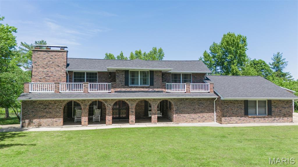 Welcome home to this stunning 3-bedroom, 3-bathroom retreat ideally located just minutes from all that Rolla has to offer, yet tucked away on a quiet dead-end road for added privacy. Situated on an amazing oversized lot, this property offers the perfect blend of convenience and peaceful living. Step inside to find beautiful wood flooring and a warm, inviting living room featuring a cozy wood-burning fireplace. The main level hosts a spacious primary suite along with a full guest bathroom, offering comfort and convenience. The kitchen is well-equipped with stainless steel appliances—featuring a new refrigerator in November 2025 —and offers a center island with breakfast bar seating (optional to stay), perfect for meal prep or gathering with family and friends. Upstairs, you’ll find two additional bedrooms and a full bathroom, providing plenty of space for family or guests. Entertain with ease in the unique bar area, complete with its own fireplace (bar area optional to stay), creating the perfect atmosphere for hosting. Additional features include a laundry room with hanging ladder, and a hot tub that stays—perfect for relaxing evenings at home. Outside, the huge backyard offers endless possibilities, complete with a charming playhouse that conveys with the property. This one truly has it all—space, charm, and an unbeatable location!