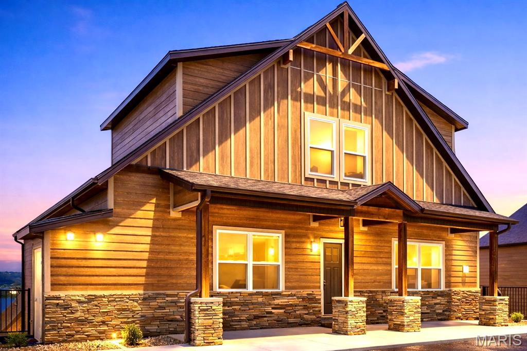 UNMATCHED TABLE ROCK LAKE VIEWS | FULLY FURNISHED WILDERNESS MOUNTAIN RETREAT This fully furnished, turnkey lakeview lodge showcases sweeping panoramic views of Table Rock Lake and offers nearly 5,000 square feet of thoughtfully designed living space. With 10 bedrooms and 9 bathrooms, the home provides flexibility and room to comfortably accommodate larger groups while maintaining privacy and functionality throughout. The expansive open-concept floor plan is ideal for gathering and entertaining, featuring dual stoves/ranges, generous living and dining areas, and seamless access to two oversized decks where the lake views take center stage. Interior highlights include two themed bunk rooms, a game and media room, and multiple spaces designed for both relaxation and enjoyment. Located just steps from the resort's amenity core, Wilderness Mountain features indoor and outdoor pools, water slides, a lazy river, pickleball and basketball courts, playgrounds, and a walking trail leading to the lake. Conveniently positioned near the Port of Kimberling, Silver Dollar City, the Branson entertainment district, and year-round Ozarks recreation, this property offers an exceptional combination of views, space, amenities, and location in one of Wilderness Mountain's most sought-after settings.