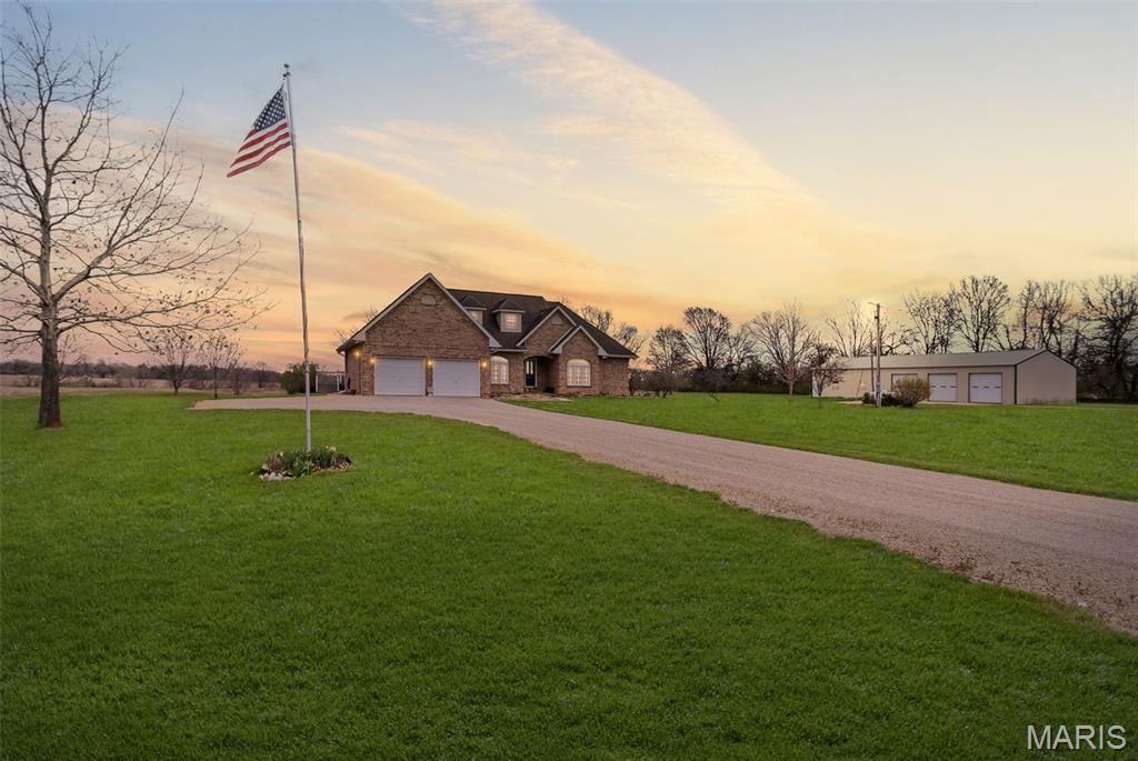 Welcome to your private escape in Jersey County, where space, functionality, and lifestyle finally come together.

Set on 5 beautiful acres, this custom-built brick home offers what most buyers are still searching for—room to live, work, and unwind without compromise. From the moment you arrive, the setting delivers a sense of privacy and freedom that’s hard to find, yet still close enough to everything you need.

Inside, the home has been thoughtfully updated with new flooring throughout and a remodeled kitchen featuring solid surface countertops, modern cabinetry, and quality finishes. The flexible 1.5-story layout now offers four bedrooms along with spacious living areas designed for both everyday comfort and entertaining.

The lower level adds even more versatility with a full second kitchen, making it ideal for multi-generational living, extended guests, or creating the ultimate hosting space.

Step outside and the lifestyle really comes to life. The inground pool creates the perfect place to relax or gather, while the expansive acreage gives you room to spread out, enjoy the outdoors, and make the property your own. The large outbuilding adds another layer of value, whether you need space for a workshop, storage, business use, or all the toys that come with country living.

Properties like this don’t come along often. If you’ve been searching for a home with land in Jersey County that offers privacy, flexibility, and true functionality, this is the one buyers wait for—and the one they regret missing.

Schedule your showing before someone else claims it.