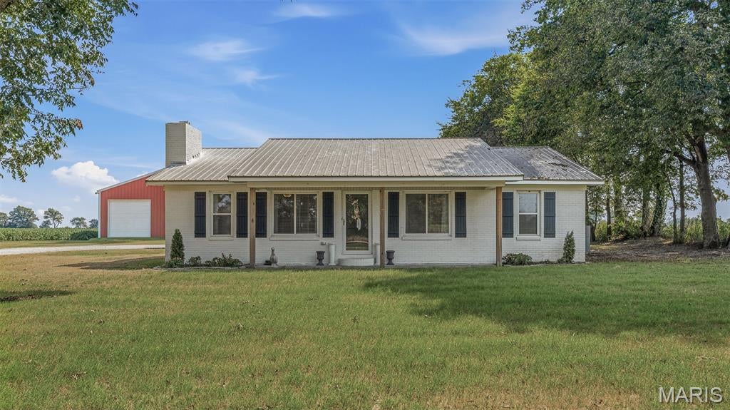 If you are looking for a spacious home outside of town, this is it!! Check out this 4-bedroom 2 bath home located in Kennett, just a few minutes away from all the local amenities. You get the rural living vibe with the convenience of town being right down the road! It is the best of both worlds! Conveniently located 3 minutes from Kennett & 9 minutes from Senath.
The oversized primary bedroom is located on a separate end of the home & has an amazing, updated ensuite. The primary bedroom closet has a fantastic sitting area, perfect for getting ready each day. 
 There is a large den that could be used as a 5th bedroom, formal dining room, game room, multi-purpose room, or anything that fits your lifestyle. The possibilities for that space are endless! The home has lots of modern updates & color schemes that flow throughout the entire house. The large kitchen is the heart of this home & makes the perfect spot for get togethers.
The exterior brick has recently been painted, giving the entire outside a modern refreshed look.

The large shop features 1200 Square feet & full electricity. There is plenty of room for all of your hobbies & tons of storage.

Call today if you are looking for a spacious, move in ready home with amazing views of unobstructed Southeast Missouri sunrises.
