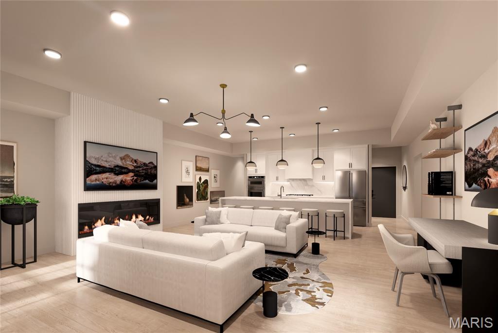 Welcome to The Augusta on Main, where luxury meets convenience in the heart of historic St. Charles. This stunning 3-bedroom, 2.5-bathroom condominium is designed for those who seek both style and functionality in a vibrant urban setting.  It's located just steps from charming local restaurants, boutique shopping, and lively cultural attractions.

As you enter, you’ll be greeted by an open-concept living space featuring sophisticated designer finishes throughout. The gourmet kitchen is a chef’s dream, complete with high-end stainless steel appliances, custom cabinetry, and a large central island ideal for entertaining or casual dining. The primary suite is a luxurious retreat, offering a walk-in closet and a spa-inspired bathroom with a large soaking tub, frameless glass shower, and dual vanities. Two additional well-sized bedrooms provide versatility for family, guests, or a home office. A full second bathroom is elegantly appointed, and a convenient half-bath is located off the main entertaining area. The property also features 2 dedicated parking spaces, access to an on-site fitness center, and a rooftop deck that offers sweeping views of the St. Charles skyline. This luxury condominium offers the ideal blend of modern amenities, chic design, and an unbeatable location. Don’t miss your chance to live in one of St. Charles’ most sought-after addresses!