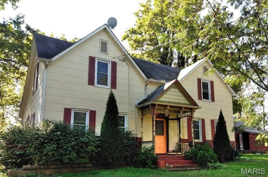 A truly unique opportunity on almost 6 acres overlooking the Katy Trail! This one-of-a-kind property features TWO separate dwellings, both filled with original character and history.

The main home, built around 1900, offers 4 bedrooms and 1 bath along with beautiful original woodwork, pocket doors, wainscoting, a butler’s pantry, generous built-in storage closets, and more. Local lore of bootlegging adds another interesting piece to the property’s history. Just outside the kitchen is an outbuilding with a covered patio with direct access to a historical wine cellar.

The second dwelling was built soon after the main home and has plenty of character of its own, including original flooring, two-sided built-in glass cabinetry, a claw-foot tub, original built-in wall cabinets, and more. This 1.5 story guest house offers 2 bedrooms, 1 bath, a full basement, dining room and living room, with the primary bedroom on the main level.

The acreage also includes a small building for lawn care equipment and a 3-sided barn near the entrance to the property.

Properties like this are hard to find! Whether you’re drawn to historic homes, looking for a restoration project, a possible business venture, or simply want acreage with two separate dwellings, there is so much potential here.

Property is being sold AS-IS. Both homes offer an incredible opportunity for someone ready to bring their ideas, updates, and personal touches to these character-filled homes.
