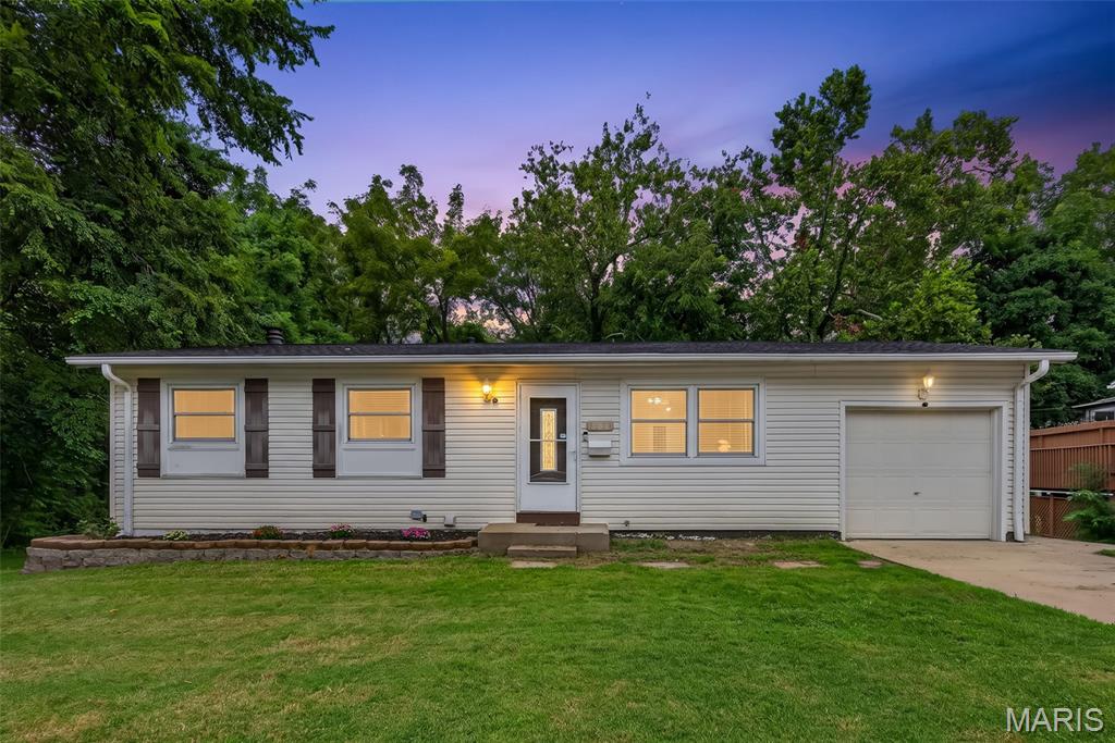 Welcome home to this charming 3 bedroom, 1 bath Ranch in Hazelwood West school district with plenty of space inside and out! Step into the bright living room, where a pass-through window keeps the kitchen connected to the heart of the home, perfect for entertaining! The kitchen features tons of custom maple shaker cabinets and appliances including gas stove/oven, dishwasher, microwave, and refrigerator. The outdoor living area is the real showstopper with a massive covered patio surrounded by established landscaping that creates the perfect spot for morning coffee, summer barbecues, or relaxing at the end of the day. The large fenced backyard backs to mature, city-maintained trees for a leafy backdrop and TONS of privacy! Three large bedrooms provide ample space to make your dream home a reality and an updated luxurious bathroom. The lower level is ready for your ideal finishes: a theater room, hobby shop, or a private home library! This one is also just across the street from the neighborhood park and playground!  A home that checks all the boxes and then some! Schedule your private tour before someone else calls it their home sweet home!
