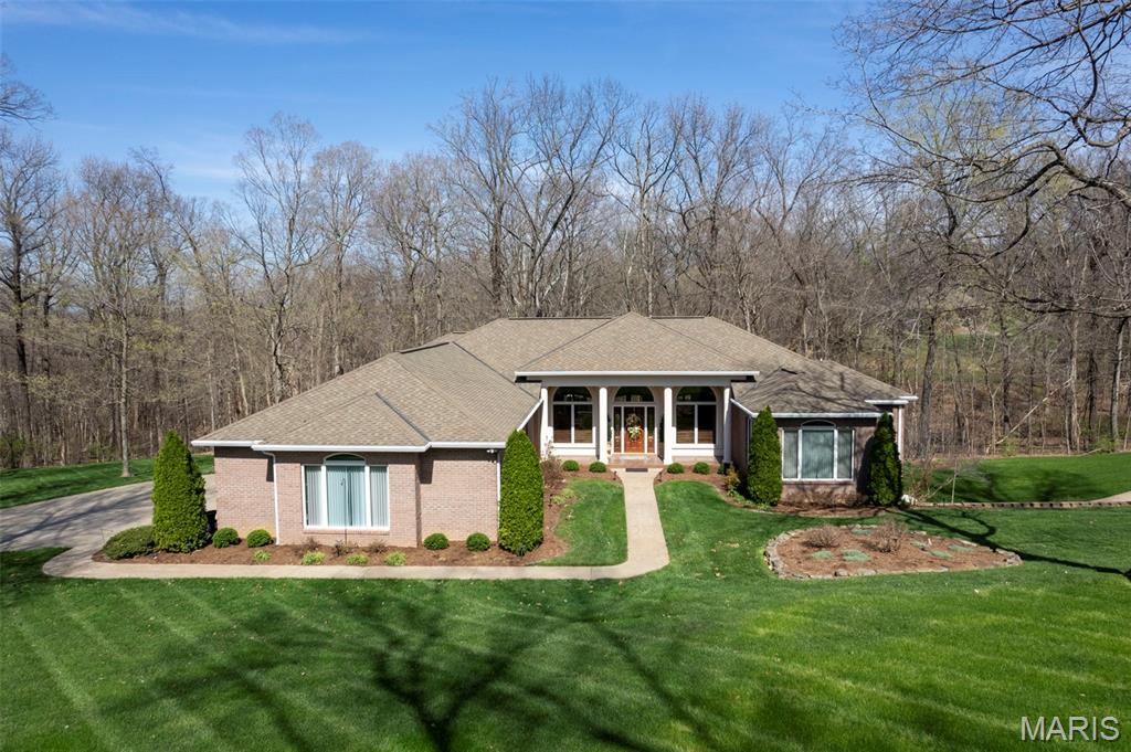 Welcome to this sprawling ranch home tucked away in a beautiful, private subdivision, offering the perfect blend of space, functionality, and peaceful surroundings. Backing to trees, this home provides a sense of privacy while still being part of a sought-after neighborhood. Inside, you’ll find a well-designed layout featuring a large kitchen, three bedrooms on the main level, along with an additional bedroom in the finished lower level. The basement offers fantastic entertaining space, making it ideal for gatherings, game nights, or simply relaxing. Step outside to enjoy the large double deck overlooking the backyard, a perfect spot for outdoor entertaining or unwinding while taking in the natural setting. The home also features a three-car garage on the main level, along with an additional oversized garage in the lower level complete with a workshop area with a convenient driveway—perfect for hobbyists, extra storage, or projects. Thoughtful upgrades include a reverse osmosis system, Generac generator, and an irrigation system for the front yard, adding both convenience and efficiency. This home offers the space you need, the setting you want, and the versatility to truly make it your own.