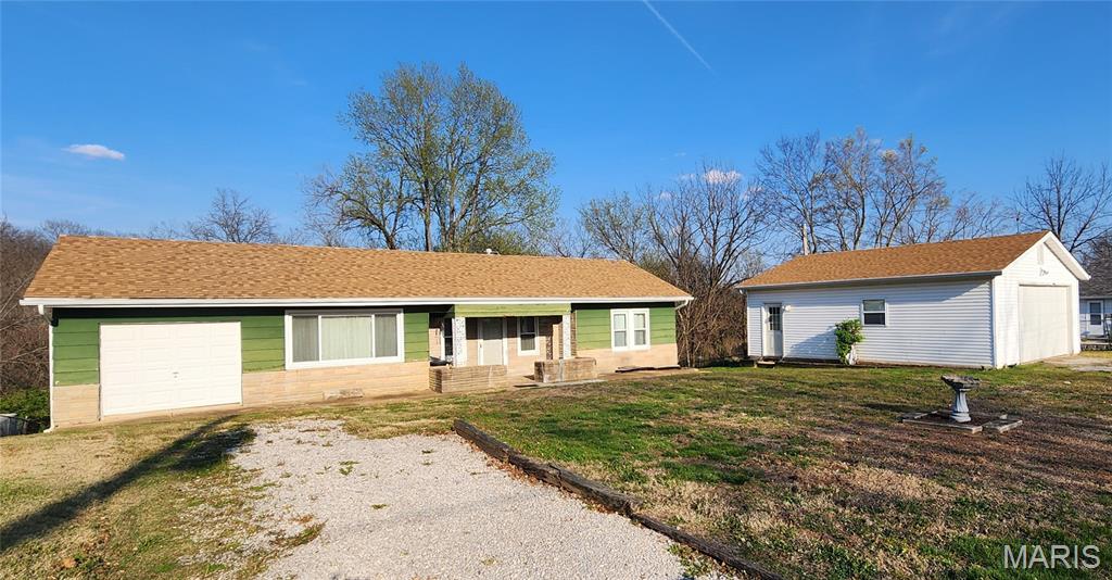 Calling all Investors! Excellent investment opportunity in a high demand area. This 2 bed, 1 bath ranch has updated windows, new roof and gutters in 2024, new AC and furnace in 2023. The 24x30 detached garage/shop has electric and a new garage door installed in 2024. It is all situated on 0.75+/- acre great for gardening, entertaining or just enjoying the peaceful view! The attached garage was used for storage and a bonus room. The home will be sold As-Is. Sellers will not make any repairs as a result of any building, occupancy, or environmental inspection.