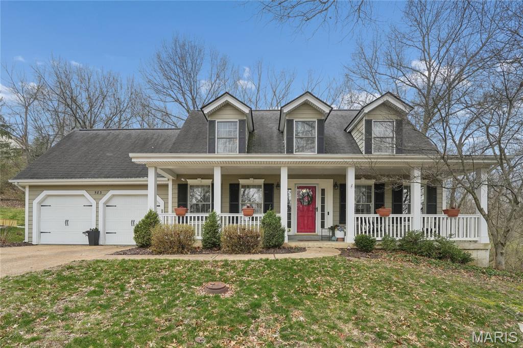 Welcome home to this wonderfully updated 2 story that backs to dense woods with large level rear yard.  Large covered front porch and private patio to the rear allow maximum enjoyment of the outdoors. Clean and crisp with newer fiber cement siding.  Inside, you will find a very open and updated interior.  Formal living room with French doors that lead to family room.  Separate formal dining with wood flooring. Family room has a gas fireplace.  Kitchen has been totally remodeled with custom cabinetry, granite counters, wood flooring, stainless appliances, center island, pantry.  First floor laundry.  Upstairs is a large master suite with private master bath.  Two additional bedrooms share the hall bath.  The basement is large, dry and ready to finish.  Home is located in Pointe Clayton and offers community pool, tennis and basketball.  Rockwood Schools. Showings start March 27th with open house on March 29 1-3pm.