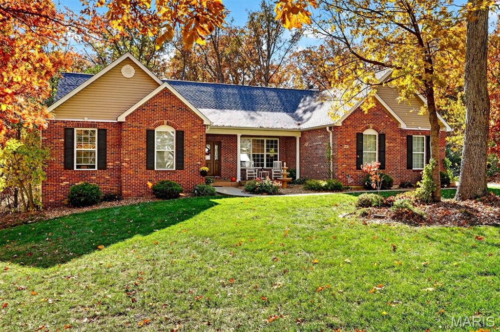 Welcome to this stunning 3-bedroom, 2-bath atrium ranch nestled on a peaceful 3.1-acre lot with a tree-lined backyard and breathtaking views through expansive atrium windows. Designed for comfort and style, this home features an open and inviting floor plan filled with natural light. The heart of the home is the spacious kitchen, showcasing custom-made 48-inch hickory cabinets, ample counter space, and a seamless flow into the dining and living area perfect for entertaining or family gatherings. Enjoy cozy evenings by one of the two fireplaces, or relax in the primary suite, which offers a luxurious jetted tub, separate shower, and walk-in closet. Step outside to take in the serenity of the private backyard, ideal for outdoor living and soaking in nature’s beauty. The home also includes a 3-car side-entry garage, providing plenty of room for vehicles, tools, and storage. Additional highlights include a 2 year-old roof for peace of mind, an unfinished walk-out basement with a rough-in for a future bath ready for your personal touch or expansion and thoughtful architectural details that make this home truly special. Whether you’re looking for privacy, modern comfort, or a place to enjoy scenic views year-round, this property combines it all in one exceptional package. Location, location, location!  Convenient to downtown Wentzville!