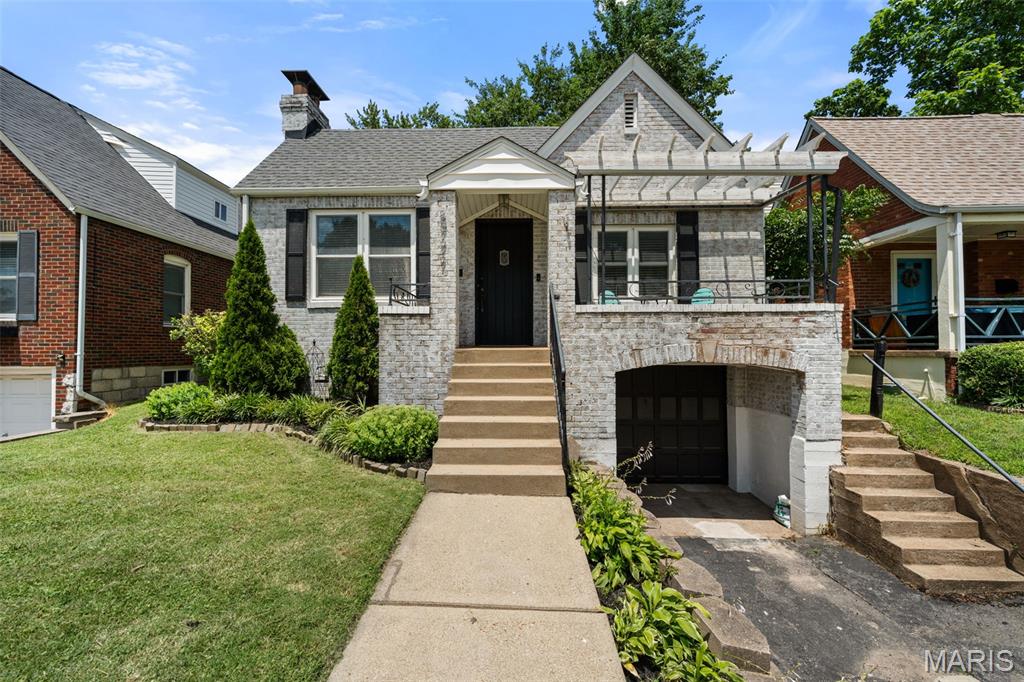 Welcome Home! This stunning 2-bedroom, 1.5-bathroom brick bungalow is perfectly situated on a quiet cul-de-sac and blends classic architectural charm with modern updates. Nestled in the heart of highly desirable Brentwood, MO, this home offers incredible curb appeal  from the moment you arrive. Enter into a gorgeous living room featuring a dramatic cathedral ceiling that creates an open, airy feel. Cozy up by the inviting gas fireplace, making it the perfect centerpiece for cozy evenings in and entertaining guests. The sizable, dedicated dining room provides plenty of space for hosting dinner parties, holiday gatherings, or everyday family meals. Enjoy a fully updated main bathroom boasting sleek, modern tile and high-end finishes that bring a touch of luxury to your daily routine. The kitchen features a gas range and stainless steel appliances and leads to the basement which serves as an additional hangout spot and has a convenient half-bath for guests. Next, go outside to enjoy your private retreat with a large, fully fenced-in backyard featuring a spacious patio—ideal for summer BBQs, outdoor dining, pets, and gardening. Let's talk about location, location, location! You are just minutes away from award-winning schools, fantastic local parks, and premier shopping and dining with quick highway access, making commuting anywhere in St. Louis an absolute breeze! Recent updates include: updated roof, AC and sewer lateral replacement all in 2023. Updated water heater (2022) and updated electrical panel (2025).