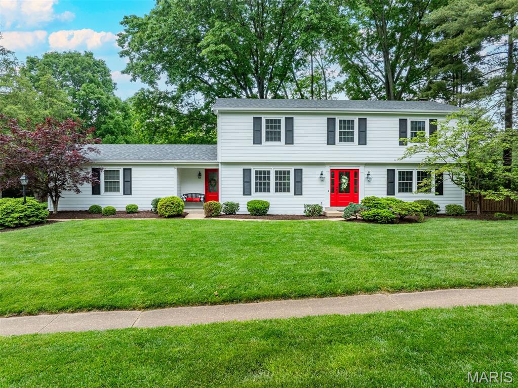 Wow! Incredible value in highly desirable Mason Valley, just steps from Queeny Park.** This classic Garrison Colonial is ideally situated on a quiet cul-de-sac and has been thoughtfully updated for today’s active lifestyle. The center hall floor plan features hardwood floors throughout the main level. The expanded living and family room creates an inviting gathering space, complete with recessed lighting, a fireplace with built-ins, and seamless access to the outdoors through new doors. Step outside to a screened porch, large paver patio with fire pit, and a spacious, private fenced backyard—perfect for entertaining or relaxing. The gazebo has been transformed into an outdoor oasis, ideal for unwinding with a drink while catching the game. The bright white eat-in kitchen offers stainless steel appliances, a center island, and picturesque views of the backyard. A convenient laundry room and drop zone provide an easy transition from the outdoors, with access from the front entry, backyard, and rear-entry garage. Upstairs, the primary suite is complemented by three additional bedrooms and a full bath featuring double sinks and a tub. The finished lower level with luxury vinyl flooring is perfect for movie nights and relaxation, and includes a walk-up for easy access to the outdoor patio.