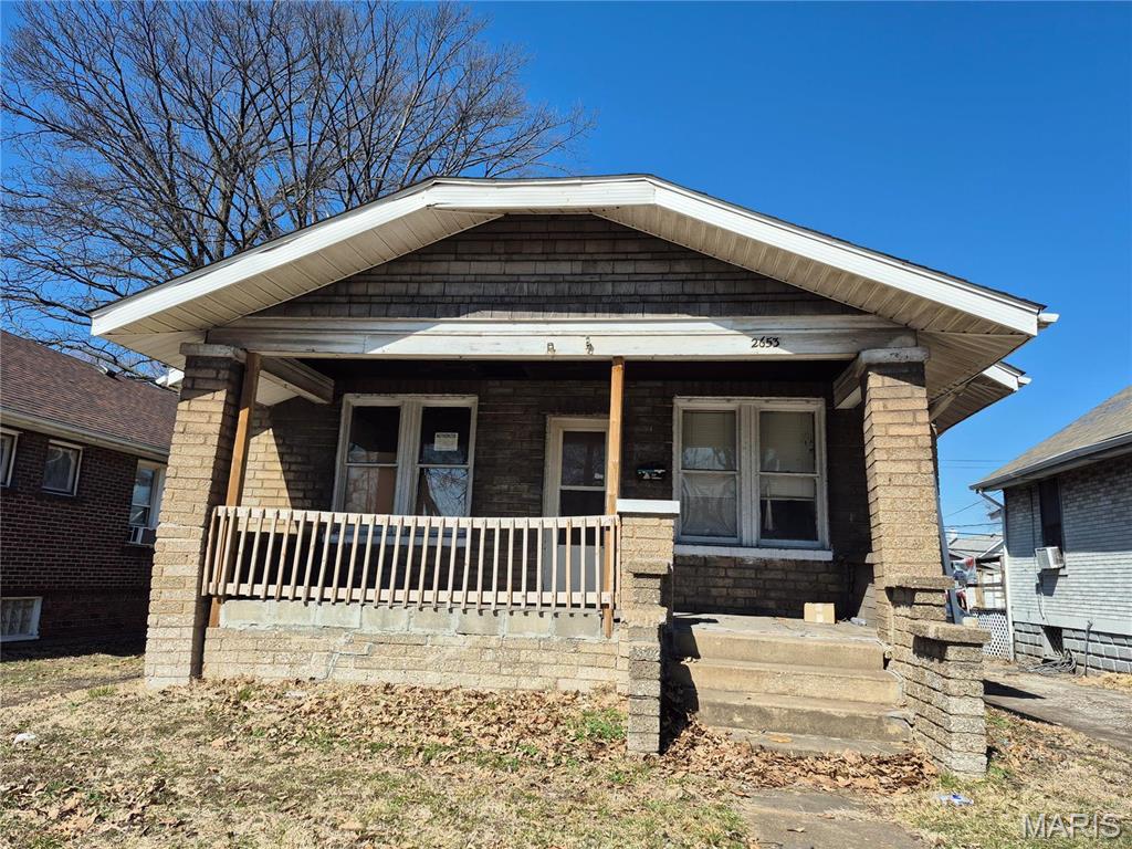 LOOKING FOR A FIXER UPPER ?? THIS IS IT!! FULL BRICK WITH LARGE COVERED FRONT PORCH. OWNER STARTED SOME REHAB WORK SOME TIME AGO. NEEDS KITCHEN, BATHROOM, HVAC, WATER HEATER, LIGHTING, WINDOWS, AND ELECTRICAL. ORIGINAL WOOD FLOORS COULD BE REFINISHED. OPEN LIVING/DINING ROOM. LIVING ROOM HAS ORIGINAL STAINED GLASS WINDOWS. BEDROOMS HAVE BEEN GUTTED. BATHROOM NEEDS TOILET, SINK, NEW TUB, AND WALLS. THERE'S A LAUNDRY CHUTE IN THE FLOOR. LOTS OF SPACE IN THE BASEMENT FOR STORAGE AND FAMILY ROOM. WATER HEATER MISSING. ROOF LOOKS NEWER BUT NOT SURE OF AGE. SELLING AS-IS INCLUDING CITY INSPECTION. A REAL DIAMOND IN THE ROUGH! NO UTILITIES SO SHOW DURING DAYLIGHT OR WITH FLASHLIGHT. GRANITE CITY IS VOTED AS THE TOP 3rd CITY FOR FIRST TIME HOME BUYERS NATIONWIDE!