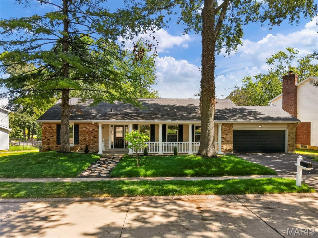 Luxury lakefront living in the highly sought after Baxter Lakes neighborhood in the heart of Chesterfield! This completely updated five bedroom, three bath ranch offers over 3,700 square feet of beautifully finished living space, an open floor plan, and breathtaking views overlooking two lakes. Beautiful LVP flooring flows throughout the main living areas, where a fireplace creates a warm and inviting focal point. The stunning kitchen is designed for both everyday living and entertaining with an oversized island, gorgeous quartz countertops, stainless steel appliances, and plenty of space to gather. The primary suite feels like a private retreat with its own beautifully updated en suite bath, walk-in closet, and an oversized sliding glass door that fills the room with natural light and allows you to wake up to the peaceful views just outside. The thoughtfully designed main level also features a private office, main floor laundry and a butler’s pantry, new windows, beautifully tiled bathrooms, modern finishes, and thoughtful updates throughout. The completely finished lower level is an incredible extension of the home, offering a spacious second living and entertaining area anchored by a cozy fireplace, three versatile bonus rooms ideal for a home gym, playroom, hobby room, additional office, or guest space, and generous storage without sacrificing finished living space. Step outside onto the expansive deck and take in the peaceful lake views from the large, private backyard surrounded by mature trees. Baxter Lakes offers beautiful walking trails and an incredible natural setting where deer, birds, and other wildlife are frequent visitors, including a resident owl that returns to the tree out back each year to raise her owlets. Enjoy the tranquility and privacy of a setting that feels like a retreat while remaining just minutes from shopping, dining, entertainment, and major highways. Located in the highly sought after Parkway School District, this is more than a beautifully updated home, it is a lifestyle that is incredibly difficult to replicate. With over 3,700 square feet of finished living space, a fully finished lower level, incredible lake views, and the perfect combination of space, style, privacy, and convenience, this is a rare opportunity to own a home you will love coming home to.