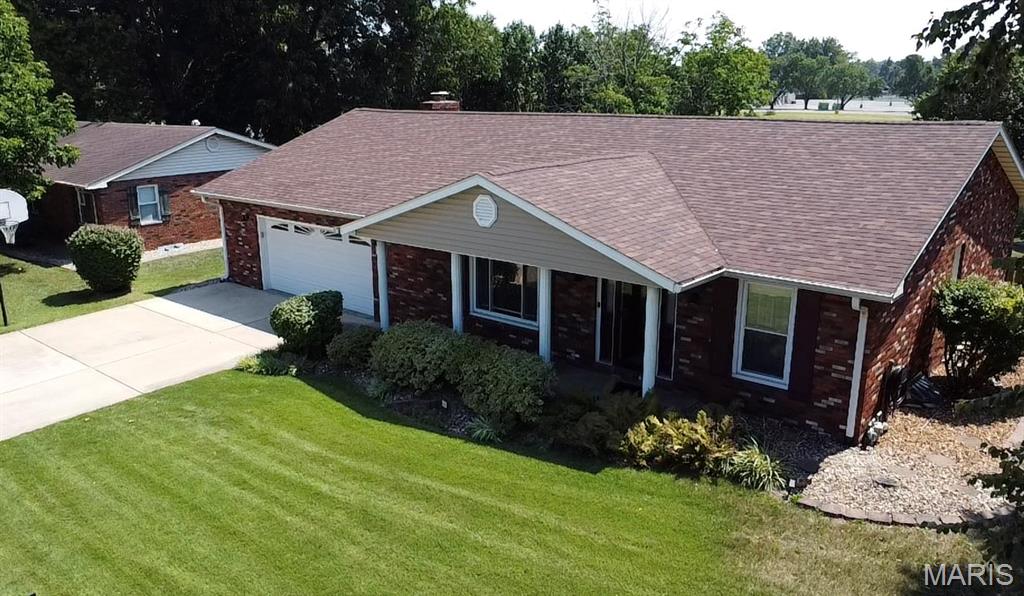 Welcome home to this well-maintained brick ranch offering comfort, space, and plenty of versatility. Featuring 3 bedrooms and 2 bathrooms, this home offers a functional layout with multiple living and entertaining spaces.

The main level includes a welcoming living room and a spacious family room complete with a fireplace, creating a cozy space to relax and gather. The lower level adds even more flexibility with two finished rooms that can be used for a home office, hobby room, recreation space, guest area, or whatever best suits your needs.

Step outside to enjoy the covered front porch, or head to the backyard where you'll find a covered 20 x 16 patio, a fenced-in yard, and a convenient 13 x 11 shed. The oversized 27 x 24 heated garage provides exceptional space for vehicles, storage, hobbies, or a workshop.

Numerous updates provide added peace of mind, including a new roof and water heater in 2024, along with a new breaker box and flooring in 2026. With its brick exterior, generous garage, finished lower-level space, and inviting outdoor areas, this home is ready for its next owner to make it their own!