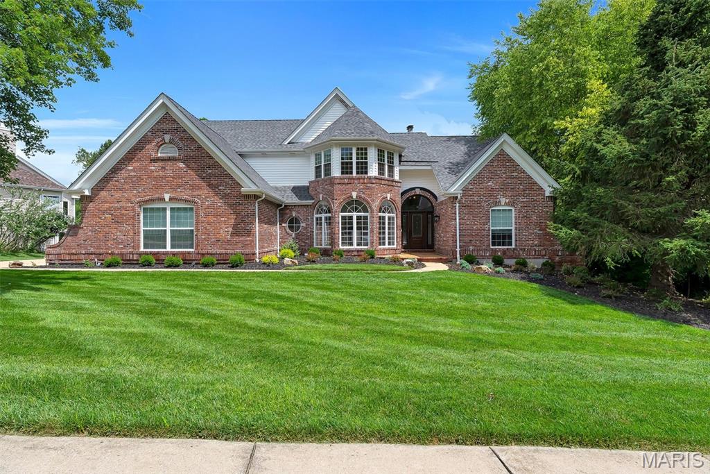 17643 Wildridge delivers a rare blend of incredible architecture and elegance in Chesterfield’s coveted Wildhorse community. With 5 bedrooms, 5 baths, 5 walk-in-closets, and 3 fireplace, this house offers incredible space, storage, and luxury. Dramatic vaulted ceilings and a breathtaking atrium create a showstopping backdrop with panoramic views of the changing seasons. The main-floor primary suite impresses with coffered ceilings and a vaulted, Tuscan-inspired bath. The kitchen needs only a cook—as it comes equipped with solid wood cabinetry, galaxy black granite, an expansive island with seating for six, and Jenn Air/KitchenAid appliances including a brand-new KA refrigerator. The lower level is a sports lover and entertainers dream, featuring a richly crafted wood bar, expansive entertaining space, a stone fireplace, and a full bedroom and bath. Outdoors, a new courtyard-style patio and newer deck frames a three-sides-private yard backing to 5 acres of undisturbed common ground, offering unmatched privacy and enjoyment of the outdoors. Recent enhancements elevate both style and comfort: new roof (August 2025), new carpet, fresh paint, some new siding, whole-house surround sound, dual HVACs (2021 & 2025), and dual water heaters (2022). A home of this character and caliber is rarely available in Wildhorse—or anywhere in Chesterfield.