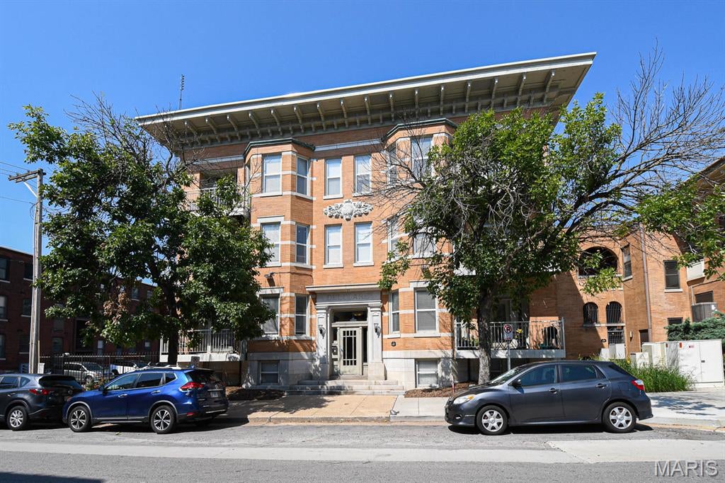 Price Reduced! Fantastic 2-bedroom condo with secured parking, just minutes from everything the city offers. Fall in love with this quiet, secluded 1st-floor unit with private deck, brand-new HVAC, fresh paint, freshly glazed tub with ceramic tile surround and tile floor.

Living area features a spacious open layout, in-unit laundry, and abundant natural light. Kitchen features granite countertops, stainless steel appliances, and 42" cabinets. Both bedrooms have plenty of closet space.

Located at the rear of the building for easy access to the secured lot, with assigned parking just steps away. Basement provides a large private storage cage. Reasonable HOA fees; building roof replaced last year.

Just 1 block from the Loop Trolley Station & minutes from Forest Park & Washington University. Residents eligible for Waterman Pool membership. Located in WashU/BJC "Live Near Your Work" area. Qualified buyers can receive up to $12,500 in down payment & closing cost assistance.