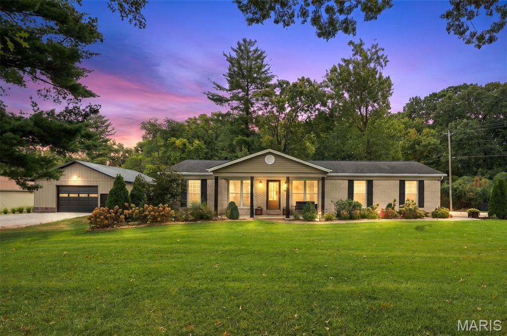 GORGEOUSLY UPDATED RANCH HOME ON 1.572 ACRES + INCREDIBLE OUTBUILDING — ALL IN THE HEART OF LAKE ST. LOUIS!

This one is truly special! Beautifully renovated from top to bottom, this stunning ranch home combines stylish updates, flexible living space, incredible outdoor amenities and room to spread out—all on 1.572 acres in an unincorporated pocket of Lake St. Louis. Enjoy the convenience of Lake St. Louis without Lake St. Louis city or Community Association restrictions—the best of both worlds!

Step inside and you'll immediately see the care that has gone into transforming this home. Updates include new Luxury Vinyl Plank flooring, and recess can lighting throughout, new front and rear doors, and a completely redesigned kitchen featuring new cabinetry, countertops and backsplash.

The main level features an impressive oversized primary bedroom, a second guest bedroom and a beautifully renovated full bathroom. The original floor plan was reconfigured to create the spacious primary suite buyers will love. A versatile landing provides the perfect spot for a home office, reading nook or cozy sitting area.

The partially finished lower level provides the home's additional living and sleeping space, complete with a full bathroom and egress window, plus plenty of room for a family room, guests, recreation or home office. A large unfinished portion offers abundant storage and workshop space, while exterior walk-up access adds even more functionality.

And wait until you see the backyard! A newer maintenance-free deck leads to a large paver patio with a beautiful pergola and natural gas fire pit—the perfect setting for summer evenings, entertaining friends or simply relaxing and enjoying your own 1.572 acres. The sellers have also added an irrigation system to help keep the property looking its best, along with an electric pet fence so four-legged family members have plenty of room to enjoy the outdoors too.

Need room for hobbies, toys, equipment, a serious workshop—or all of the above? The newer 32x32 metal outbuilding is an absolute showstopper, complete with electric, loft, workshop area, shelving and double rear doors for easy access. A massive 13x32 covered overhang provides even more usable space for equipment, entertaining or covered outdoor storage.

A beautifully renovated home in 1.57 acres. Incredible outdoor living. And a 32x32 outbuilding that's nearly impossible to find in this location.

All of this in the heart of Lake St. Louis while remaining unincorporated—giving you the convenience of the location without Lake St. Louis city or Community Association restrictions.

This isn't just a house—it's the kind of property buyers wait for.
