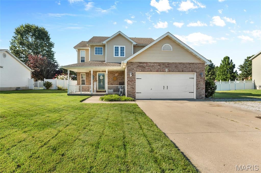 Welcome to this inviting 4-bedroom, 2.5-bath two-story home, where desirable updates, spacious living areas and exceptional outdoor amenities come together. A welcoming covered front porch invites you inside. The beautifully updated kitchen takes center stage with granite countertops, stainless steel appliances and convenient countertop seating. A dining area is situated between the kitchen and living room, creating an inviting flow for everyday living and entertaining. The living room features a fireplace, while a separate dining room, currently utilized as an office, provides flexible space for today's lifestyle. A bonus room located off the garage offers additional versatility and can be used as a home office, hobby room, or storage space. A half bath completes the main level. Upstairs, you'll find four bedrooms and a shared full bath. The spacious primary suite provides a relaxing retreat with a jetted tub, separate shower, dual vanities and a walk-in closet with built-in dresser and shelving.  Step outside to an inviting outdoor retreat designed for relaxing and entertaining. The covered deck extends the living space outdoors and leads to the above-ground pool, while an outdoor bar allows for the perfect spot for gathering with friends. A fire pit creates another inviting space to enjoy evenings outdoors. Parking is not an issue due to the oversized driveway and 2 car garage.  With its spacious floor plan, updated kitchen and baths and its exceptional outdoor living spaces, this home is ready for you to enjoy! It is located outside city limits and conveniently situated near major highways and easy access to surrounding communities.