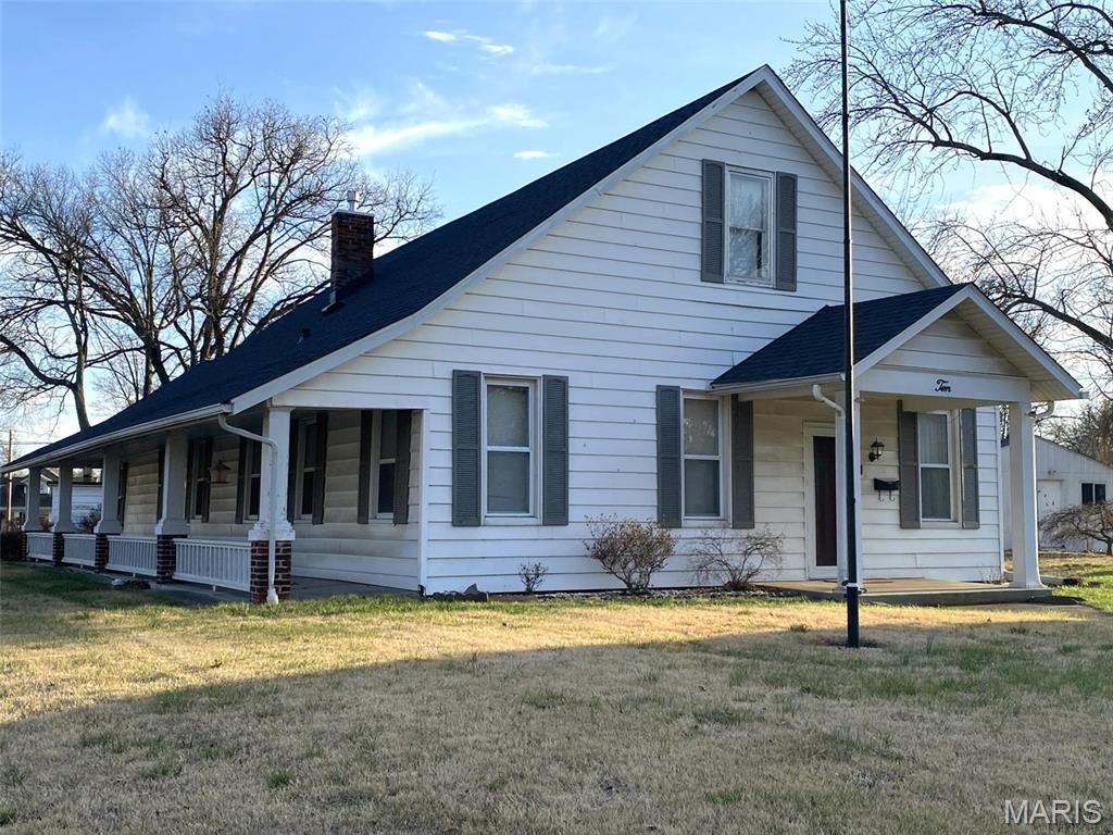 Charming vintage home (circa 1837) on a spacious corner lot in Freeburg! Relax on the welcoming front porch and imagine summer evenings with lemonade, cookies, or wine dinners with friends. Inside you’ll find generously sized rooms and flexible spaces that vintage homes often provide. The large living room could accommodate both living and dining areas, allowing the formal dining room to serve as a potential third bedroom or home office. The oversized bathroom features a jetted tub and separate shower. The country kitchen offers a center island for extra workspace and storage, and the gas stove and dishwasher remain. Just off the kitchen is a convenient laundry/utility room with washer and dryer included—also a great landing zone from the covered patio and garage, helpful for active lifestyles. The detached two-car garage includes a workbench and hobby space, plus a storage shed. The yard is ready for gardening and already features a firepit. Whether you're looking for a home with space to spread out, or a place to enjoy quiet small-town living, this property offers a wonderful opportunity. You will appreciate the convenient location with easy access to the Metro St. Louis area and Scott AFB.