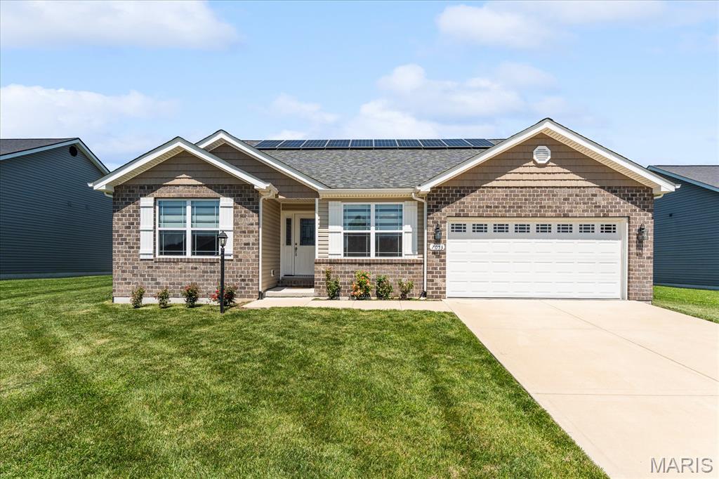 Situated in Glen Carbon's sought-after Savannah Crossing neighborhood, this 4-bed, 2-bath ranch delivers nearly 2,000 square feet of smart, comfortable living plus a massive basement that nearly doubles your usable space. Located in the highly rated Edwardsville School District with direct neighborhood access to the MCT Trail, and minutes from shopping, dining, and major interstates. The open-concept main level is anchored by a giant family room with vaulted ceilings. The kitchen features an expansive center island, farmhouse sink, stainless steel appliances, granite countertops, 42" soft-close cabinetry, convenient pantry, and dining area. Whether you're cooking for yourself or feeding a crowd, this kitchen handles it. The primary suite includes dual vanities, a marble shower, and separate garden tub. Downstairs, the massive full basement offers incredible potential with an egress window, rough-in for a future bathroom, and a newer sump pump, ready for you to finish it your way. Extra features for long-term added value include an owned solar panel system and an electric vehicle charging port in the garage. Savannah Crossing is one of the Metro East's most popular communities for good reason. Call today to schedule your private tour.