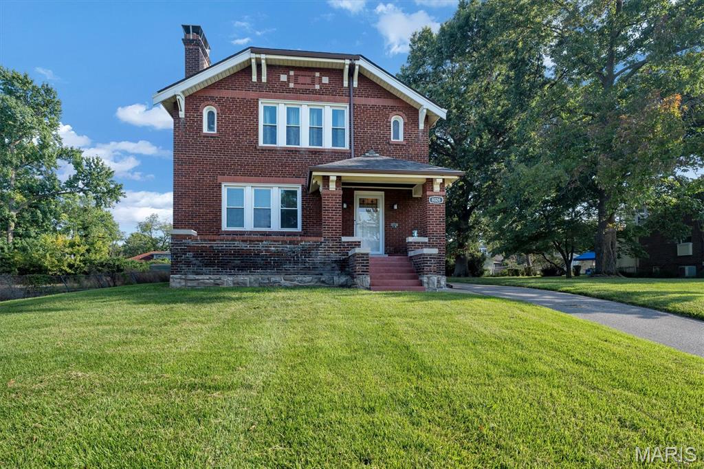 Walk to UMSL! This beautifully renovated 3-bedroom, 2-bath brick European-style home offers the perfect blend of historic character and modern convenience, all in an unbeatable location directly across from campus. Formerly known as the “International House,” this distinctive home is filled with charm, including original hardwood floors, leaded and stained glass, plaster walls, beautiful archways, an open staircase, and a welcoming front porch.

The bright, open main level features spacious living and dining rooms, a completely updated kitchen with stainless-steel appliances, and a lovely sunroom—perfect for morning coffee or relaxing at the end of the day. Three generously sized bedrooms and updated bathrooms provide plenty of space and comfort.

The oversized lot, oversized 2-car garage, and additional parking are a rare find in this location. Recently installed roof and dry basement provide additional peace of mind.

Whether you're looking for your next home, a property near UMSL, or an investment opportunity, this one is worth a look. Beautifully updated, full of character, and ready for its next chapter!

A Choice Home Warranty will transfer to the Buyer.