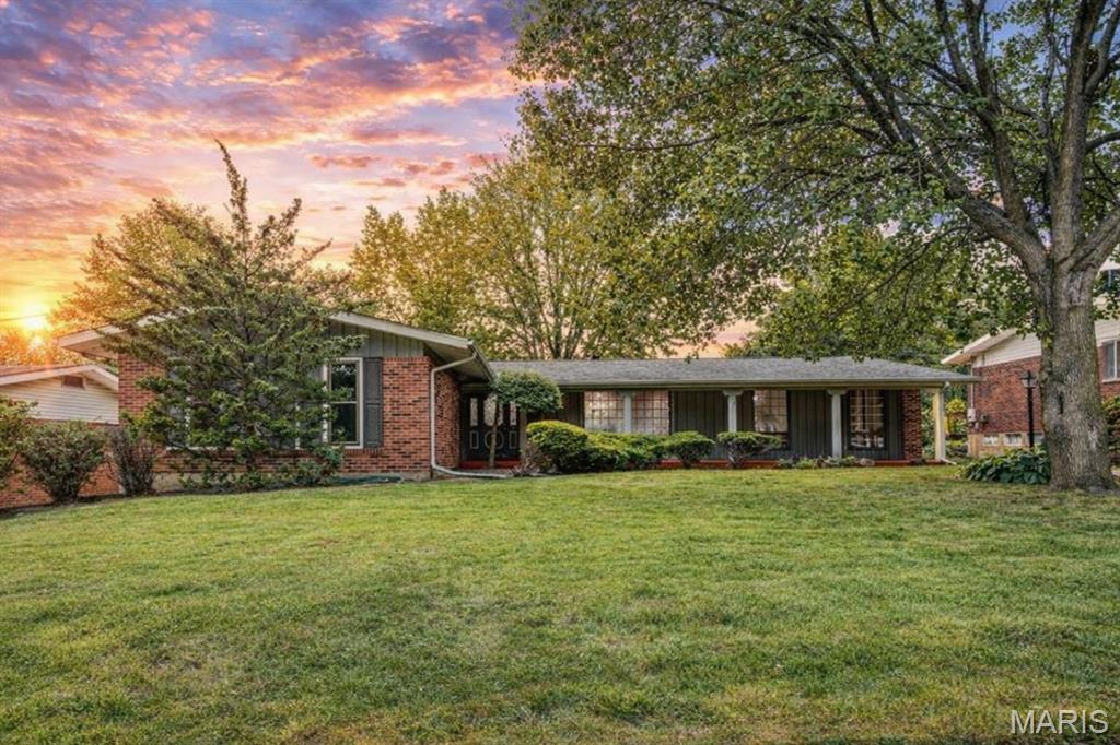 Welcome home to this beautifully updated 4-bedroom ranch in the heart of Florissant, designed with space, comfort, and everyday living in mind. From the moment you step into the expansive entry foyer, you will feel how seamlessly this home flows for both busy mornings and relaxed evenings.

Original hardwood floors carry throughout the main level, leading you into multiple living spaces perfect for growing families, whether hosting holidays, enjoying movie nights, or giving everyone their own place to unwind. The cozy family room with fireplace opens directly to the updated eat-in kitchen, featuring modern cabinetry, solid surface countertops, stainless steel appliances, and a clear view of the backyard so you can keep an eye on kids or pets while you cook.

Step outside to your screened-in porch, the ideal spot for morning coffee, family dinners, or letting the kids play while you relax comfortably.

The primary suite offers a peaceful retreat with an updated private bath, while three additional bedrooms provide flexibility for kids, guests, or a home office.

Downstairs, the finished lower level expands your living space even further, perfect for a playroom, teen hangout, home gym, or game day setup, plus additional rooms ready for storage or future customization.

Outside, enjoy a partially fenced yard with room to play, and an oversized rear-entry two-car garage with a dedicated workroom, ideal for hobbies, projects, or extra storage.

This is more than a house, it is a place where memories are made, routines feel easy, and there is room for everyone to grow.