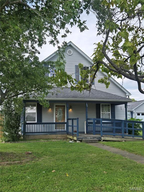This adorable farmhouse style 3-bedroom home on a corner lot at the edge of town is a true gem, blending comfort and style with modern accessibility. Fresh paint throughout. Main bedroom has new flooring, large closet and walk-in shower. Nicely updated kitchen with large panty and breakfast bar. Relax on the huge  deck or in the sunroom.  Privacy fence on part of the yard to keep the kiddos and fur babies safe.  2 car garage and 2 car carport for all your toys! Also handicapped accessible.