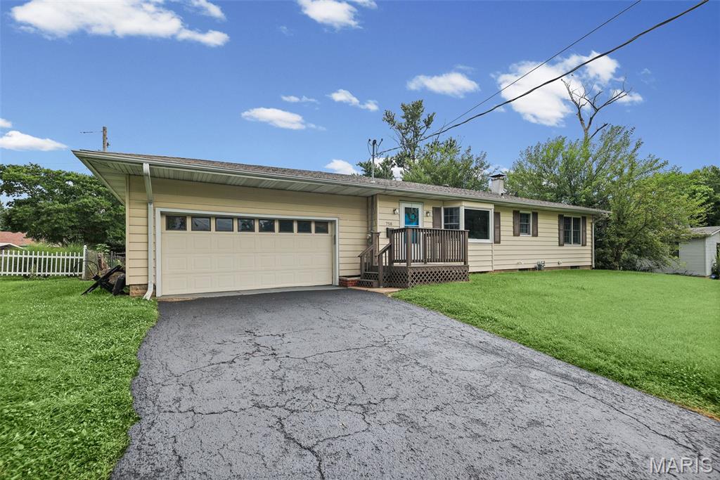Be Ready for the New School Year in Bethalto School District!  Just listed, 3 bedroom, 2 bath, 2 car garage with drive thru to back yard.  Kitchen to include dishwasher, microwave, and refrigerator.   Large living room with wood floors.  Whole house attic fan.  Large Family/Rec room in lower level with bath.  Washer and dryer to stay.  Deck off back to patio in the private fenced  back yard.  Brand new sewer lines.  Lots of updates.  Almost new Furnace. Occupancy permit in place and home qualifies for USDA zero down payment.