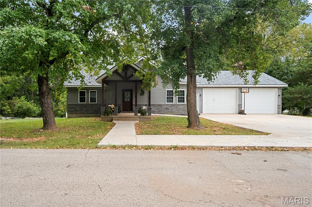 Just a short drive from the Meramac River, you will find a mature structure with a brand new makeover! Fully remodeled in 2024 (with an added bedroom AND attached garage), the home has been thoughtfully updated, blending modern comfort with warm, rustic character. The 3 spacious bedrooms each feature a walk-in closet and a private full bathroom, giving everyone their privacy. Open floorplan flows seamlessly through the kitchen, living room and dining area. Stepping out back, you can relax on the new deck that spans the entire length of the home, and enjoy the peaceful view of the wooded back yard. Extra large garage has space for all of your outdoor toys! Come tour this gem before it is gone!