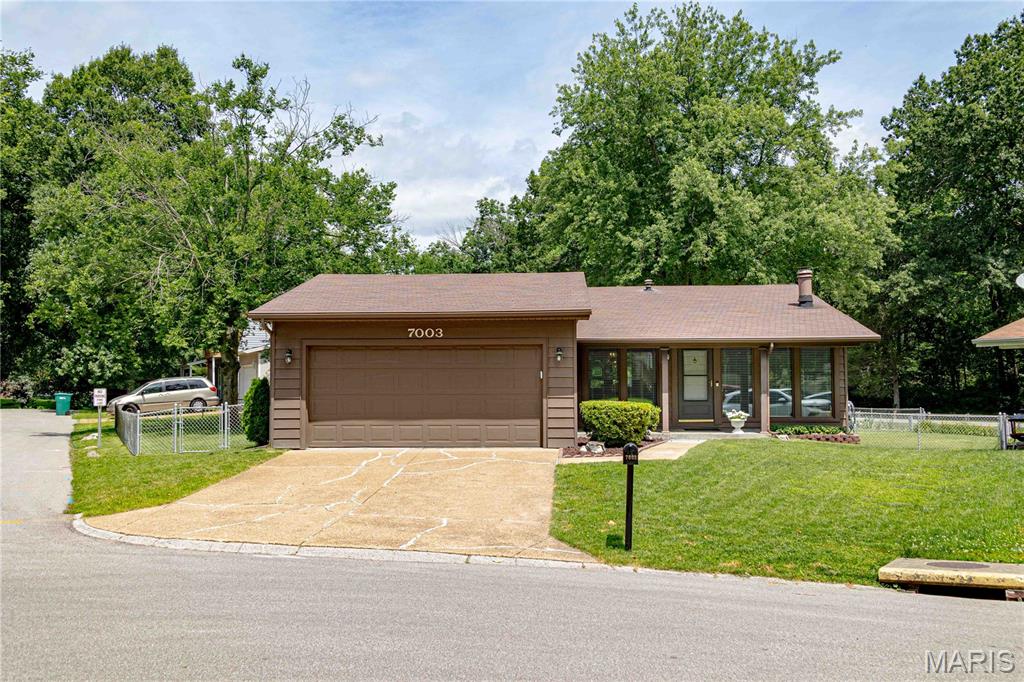 This beautifully cared for 4 bed, 2.5 bath home in Barnhart offers comfort, charm, and space in all the right places. The inviting front exterior sets the tone, leading into a bright living and dining area with large windows that fill the home with natural light. The kitchen features warm wood cabinetry and plenty of room for everyday meals or gatherings. The main floor has four bedrooms including a private primary suite. Step outside to the covered patio from the master bedroom or kitchen, perfect for morning coffee, outdoor dining, or relaxing in the shade. 
The lower level expands your living space with a fantastic recreation room, perfect for movie nights, game tables, or a home gym setup. Just steps away, the impressive custom bar area offers the ideal spot for entertaining, complete with a spacious bar counter, seating, and room for all your hosting essentials. Whether you’re gathering with friends or enjoying a quiet evening in, this basement delivers comfort and versatility. The subdivision also offers pickleball courts, basketball nets, baseball fields and a picnic area.
With its peaceful setting, mature trees, and convenient location, this home is ready to welcome its next owners.

Potential Buyers are encouraged to verify the school districts in case of changes.  Measurements should also be verified as they are approximate.

Please excuse the congestion on the street.  Cables are being installed in the subdivision.