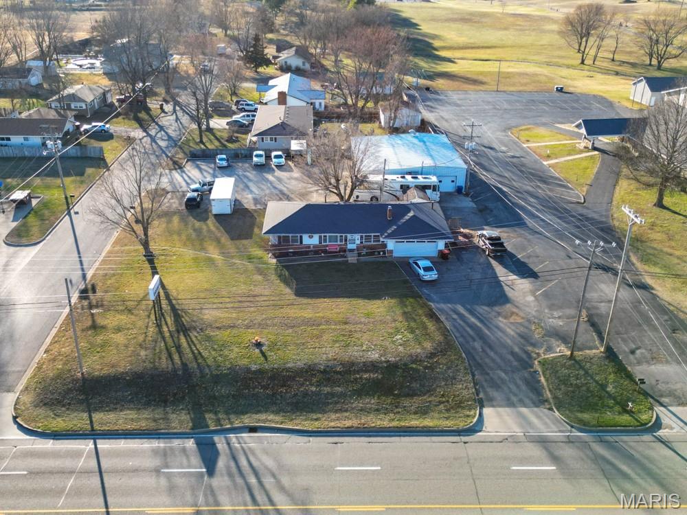 TWO INVESTMENT PROPERTIES IN ONE TRACT!  Positioned along highly traveled Highway 5, this versatile investment opportunity offers a rare combination of residential income and commercial potential in one strategic location. With excellent visibility, steady traffic flow, and flexible use options, this property is ideal for investors seeking multiple income streams. The property features a 1,300 sq ft rental home alongside a separate 2,800 sq ft commercial shop building, allowing each to be leased independently. This setup creates strong income potential while offering flexibility to owner-occupy one space and rent the other, or lease both for maximum return. The home provides comfortable living accommodations with a functional layout, inviting living spaces, and good natural light. A practical kitchen, well-sized bedrooms, and usable outdoor space make it appealing to a wide range of tenants. Its proximity to local amenities helps support consistent rental demand and long-term occupancy. The commercial shop building adds significant value, offering high exposure along Highway 5. Ideal for a variety of uses such as automotive, contractor space, retail, or storage, the building is designed for functionality with ample workspace and easy access for vehicles and equipment. The visibility and accessibility make it especially attractive for businesses that rely on traffic and convenience. With clear separation between the home and shop, both spaces can operate independently, minimizing tenant overlap and allowing for flexible lease structures. Ample parking and easy highway access further enhance usability for both residential and commercial tenants. Beyond immediate income potential, the location offers long-term upside. Properties along high-traffic corridors continue to see strong demand, positioning this investment for future appreciation or expansion.
Whether you’re looking to generate steady rental income, operate a business, or expand your portfolio, this Highway 5 property delivers a unique and flexible opportunity with strong earning potential.