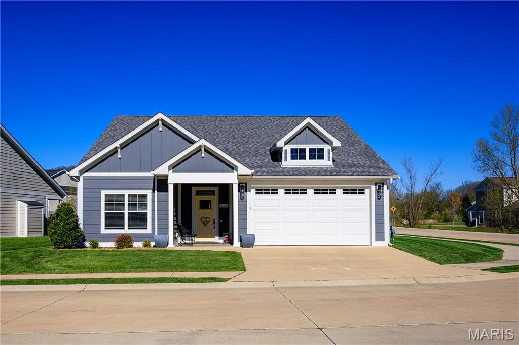 As one walks into this beautiful craftsman home they will immediately notice the open concept with the living room, kitchen, and dining room bathed in sunlight chining through the large windows surrounding this area. The kitchen features all stainless steel appliances and a large island. The fireplace is the center of the living room area.
The bedrooms are spacious. The primary is off the living room, with two bedrooms located down the hallway off the entry.
The back yard features a fenced area and a covered back porch.