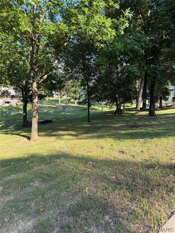 Here's your chance to build your dream home in the heart of DeSoto. 5 lots located in the heart of town. Quiet area. Excellent location. With access to public water, sewer, electric and natural gas. Lots # 6,7,8,9 & 10 of Rathbun Add. Zoned residential currently, however seller is open to considering a contingent contract subject to buyer obtaining city approval for rezoning to commercial and/or approval for duplex or townhome development. Excellent opportunity for potential multi-family development in a growing area. Buyer to verify all zoning, rezoning, and permitted use requirements with the city.
