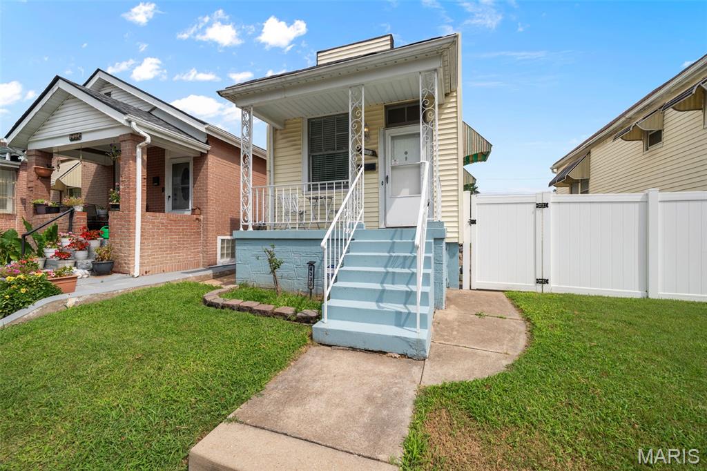 (c.) 1915: Cozy and adorable move-in-ready bungalow located just steps from the iconic Bevo Mill itself! Featuring an efficient and logical layout, this 1+ bedroom, 1 full bathroom home can be considered the "Goldilocks" sized home for modern living. A great covered front porch (perfect for watching the midwest thunderstorms roll in) leads you inside to a nice formal living room featuring newer flooring and historic original moldings & baseboards. Down the hall, you'll find the spacious main floor private bedroom (not a shotgun style layout). Then a great kitchen featuring newer appliances, ample cabinets and a great light-filled dining area/breakfast nook. An updated tiled full bathroom completes the main floor. The lower level offers a bonus partially finished "sleeping area" room (not considered a bedroom but great as a guest space or home office, etc) plus laundry area and lots of extra storage. Out back find a great level and spacious backyard (complete with a nice side yard too), covered patio area, newer low-maintenance vinyl privacy fence and a convenient 2-car parking pad for off-street parking. Why rent when you can own a cute place of your own, within walking distance to brunch at Bevo Mill, or grab a drink at Tim's Chrome Bar, or dinner Mariachi's II Mexican restaurant just around the corner!
