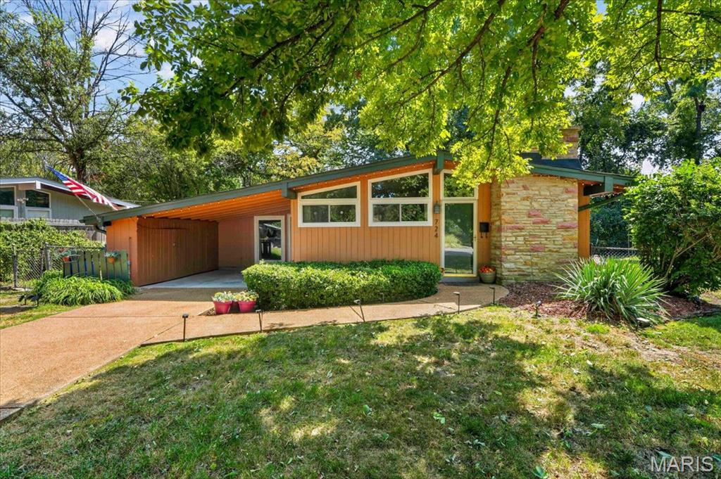 A True Mid-Century Modern Gem in Historic Ridgewood      
Step into the timeless design and effortless livability of this distinctive Mid-Century Modern home in the highly sought-after Ridgewood neighborhood. Built in the early 1950s, this beautifully proportioned ranch reflects the clean lines, open spaces, natural light, and connection to the outdoors that define classic Mid-Century Modern architecture.
Set at the end of a quiet cul-de-sac, 724 Fieldcrest offers approximately 1,682 square feet of living space with 3 bedrooms and 2 full baths. Inside, an open and airy floor plan creates an inviting sense of space, with vaulted ceilings and expansive windows filling the living and dining areas with natural light. A handsome wood-burning fireplace provides a warm architectural focal point, while the home's thoughtful layout is equally suited to everyday living and entertaining.
The home's Mid-Century character is complemented by a number of thoughtful updates, including an updated kitchen with custom cabinetry, stainless steel appliances and ceramic tile flooring. A spacious addition with skylight provides valuable flexibility, while a separate den/office offers an ideal work-from-home space, study or retreat.
Outside, the appeal continues with a large, level and private yard backing to mature trees. A deck creates a natural setting for outdoor entertaining, while the attached carport and storage shed add everyday convenience.