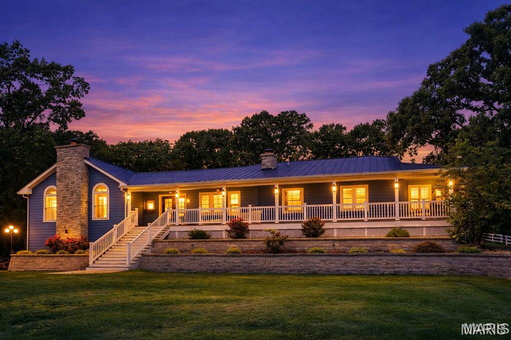 Welcome to a quiet, private country retreat set on two parcels totaling 24 acres (MOL). This exceptional estate offers everything you need for livestock, recreation, and luxury rural living.
The acreage features a fully fenced pasture, and a picturesque pond with its own fountain. The home is built to last with diamond coat siding and 26-gauge metal roofing, combining durability with timeless curb appeal.
Inside, you’ll find hardwood floors, abundant natural light, and warm, inviting living spaces. The chef’s kitchen includes a spacious island, granite countertops, induction cooktop with pot filler, stainless steel appliances, and striking stone accent walls. Enjoy the ambiance of one the main level primary suite is a true retreat, offering beautiful views, private access to the wrap around porch, and separate his and hers walk in closets. The spa inspired primary bath features dual sinks, floor to ceiling windows, a soaking tub overlooking the landscape, and a stunning stone walk in shower. The partially finished basement includes a dedicated theater room. Home can be sold furnished depending on sale price. 
APPRAISAL ON HAND AVAILABLE TO BUYER/BUYERS UPON ACCEPTED OFFER.