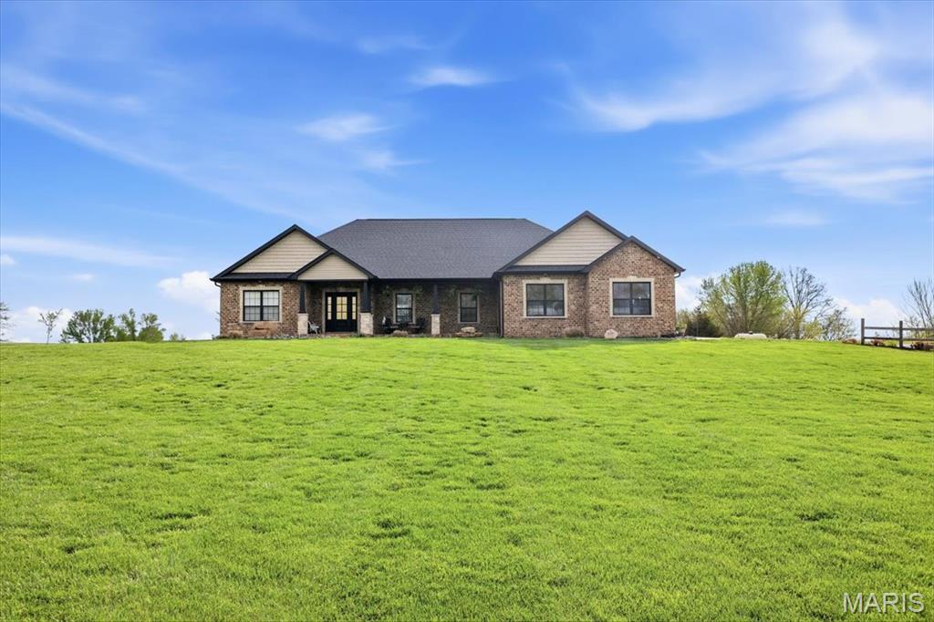 BACK ON THE MARKET DUE TO BUYER FAILURE TO OBTAIN FINANCING 2 WEEKS PRIOR TO CLOSE! 
Beautiful 3 Bed, 2.5 Bath Ranch built In 2020 on 2.5 Acres – Modern Living with Incredible Outdoor Amenities!
This beautifully designed ranch home offers a modern open floor plan with 9’ ceilings throughout and a show-stopping living room featuring 12’ Crawford ceilings and a large statement fan. The heart of the home is the bright, open kitchen showcasing white cabinetry, a large gray island, quartz countertops, and a separate bar island—perfect for entertaining. A spacious walk-in pantry and dedicated office space add both function and flexibility.
The primary suite is a true retreat with a double sink vanity, oversized walk-in shower, and an expansive walk-in closet that conveniently connects to the main-floor laundry room. Two additional bedrooms are located on the opposite side of the home with a full bath in between, offering privacy and a well-designed layout. A half bath is perfectly positioned off the garage entry. The full unfinished basement offers endless potential with a bathroom rough-in and space to easily add two additional bedrooms. It also features a walk-up entrance to the attached 2-car garage.
Step outside through glass doors off the dining area to your private backyard oasis—complete with a heated in-ground saltwater pool (2024), hot tub, and patio area, ideal for relaxing or entertaining.
The property truly shines with a **40x50x12 finished pole barn** featuring three garage doors, a full bathroom, gas cooktop, and beautifully finished cedar-lined interior. An attached lean-to can easily be added-concrete pad is already there! Additional smokehouse/storage shed, and garden area complete the outdoor setup.
Situated on 2.5 acres just minutes from town, this property also includes a full lawn irrigation system and built-in exterior lighting for added convenience and curb appeal.
-AGENT OWNED-