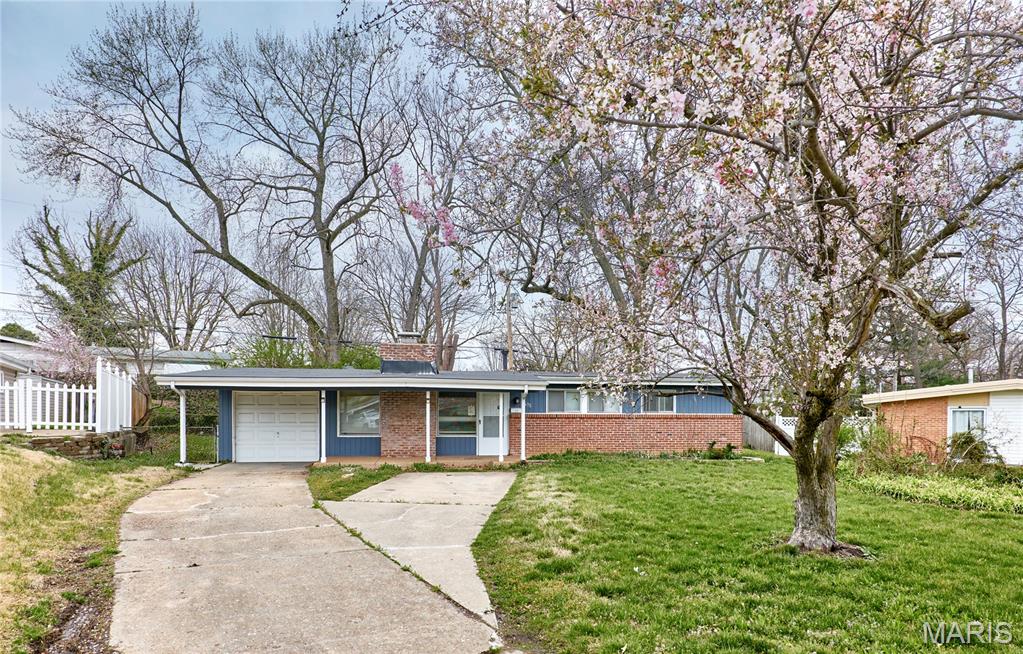 Welcome to this charming and well-maintained ranch home in a convenient Florissant location! Offering 3 bedrooms, 2 full bathrooms, and over 1,300 square feet of living space, this home features an open and inviting layout with vaulted ceilings and a cozy decorative fireplace. Recent updates include fresh paint, new flooring, and new appliances, making this home move-in ready. The light-filled kitchen provides ample cabinet and counter space, perfect for everyday living and entertaining. Enjoy low-maintenance finishes throughout and a spacious primary suite for added comfort. Step outside to a screened-in porch overlooking the backyard - ideal for relaxing or hosting guests. Additional highlights include a 1-car garage and a quiet, established neighborhood setting. Conveniently located near shopping, schools, parks, and major commuter routes, this home offers both comfort and accessibility. A great opportunity for homeowners or investors alike - schedule your showing today!
