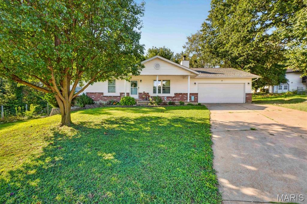 Welcome to this charming 3-bedroom, 2-bath home in Cedar Hill! The main level features vaulted ceilings with a fireplace and new flooring throughout, along with fresh, updated paint that gives the home a bright, refreshed feel. The spacious unfinished basement offers tons of potential for additional living space, a recreation area, home gym, workshop, or storage. Enjoy relaxing or entertaining on the covered deck overlooking the property. Recent updates include a new dishwasher and sink/garbage disposal. For added peace of mind, the home comes with a 1-year systems home warranty. Don't miss this opportunity to make this well-maintained home your own!