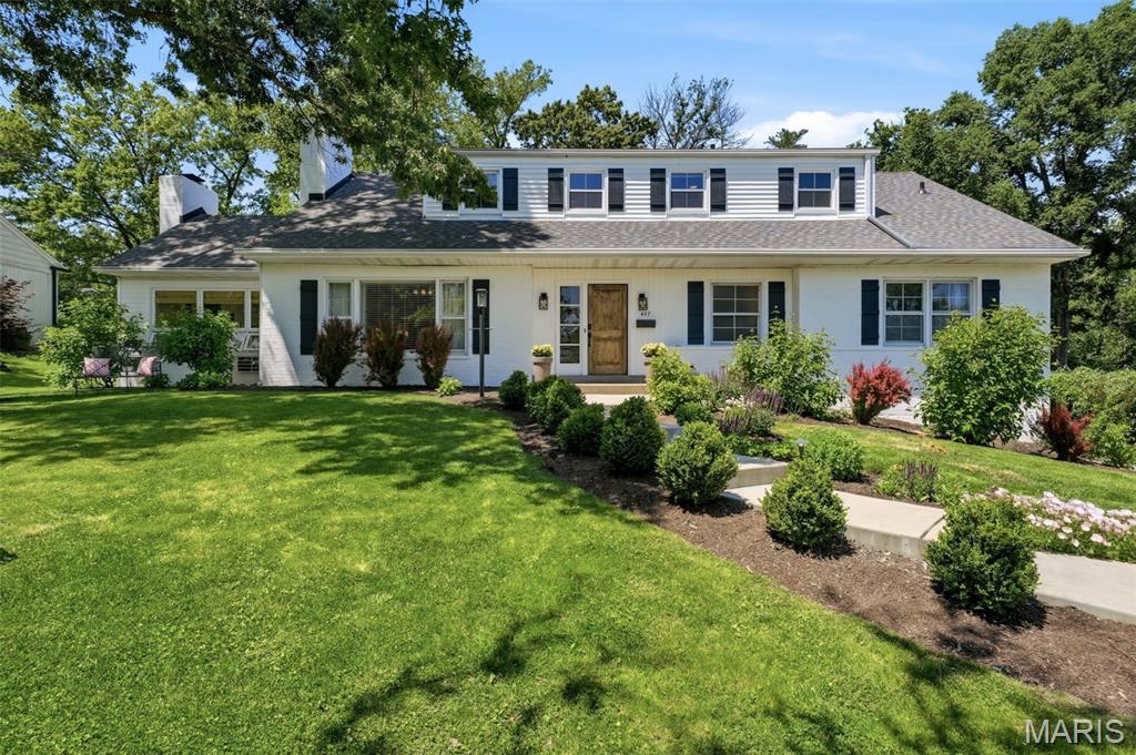Imagine living on a beautifully landscaped half-acre lot in Glendale, where the indoor and outdoor living spaces are equally extraordinary. Perfectly situated on a quiet cul-de-sac in one of Glendale’s most charming neighborhoods and within sought-after Kirkwood Schools, this home immediately captivates with its stunning curb appeal, lush mature landscaping, and elegant landscape lighting.

While the exterior is undeniably beautiful, nothing prepares you for what awaits inside. From the moment you enter, this home unfolds in the most unexpected and breathtaking way, revealing an incredible collection of rich, expansive, and thoughtfully designed living spaces that simply must be experienced to be appreciated. Every room offers a sense of warmth, character, and scale rarely found, creating a home that feels both luxurious and deeply inviting.

A gorgeous hearth room with hardwood floors and wood-beamed ceilings flows seamlessly into the dining room, creating the perfect setting for everyday living and entertaining. Just beyond, a cozy den features refinished hardwoods, vaulted ceilings, and a charming fireplace flanked by built-in bench seating with storage.

The beautifully updated open-concept kitchen offers stainless steel appliances, a walk-in pantry, breakfast bar seating, and effortless flow into the expansive Great room. Bathed in natural light, this remarkable gathering space features a dry bar with wine/beverage cooler and picturesque views of the backyard oasis and patio. Connecting the family room and den is a newly added three-season sunroom with floor-to-ceiling windows and abundant space for lounging, dining, and entertaining year-round.

The main-floor primary suite provides comfort and convenience with a beautifully appointed en suite bath with a curbless steam shower. A second spacious main-floor bedroom offers flexibility for a home office or studio, while two spacious upstairs bedrooms provide room for everyone. One upstairs bedroom even includes an attached bonus room—perfect as a shared bedroom, office, nursery, or creative space.

Adding to the incredible lifestyle this home offers, a nearby cut-through walking path provides easy access to dining, shopping, and coffee shops just a short stroll away.