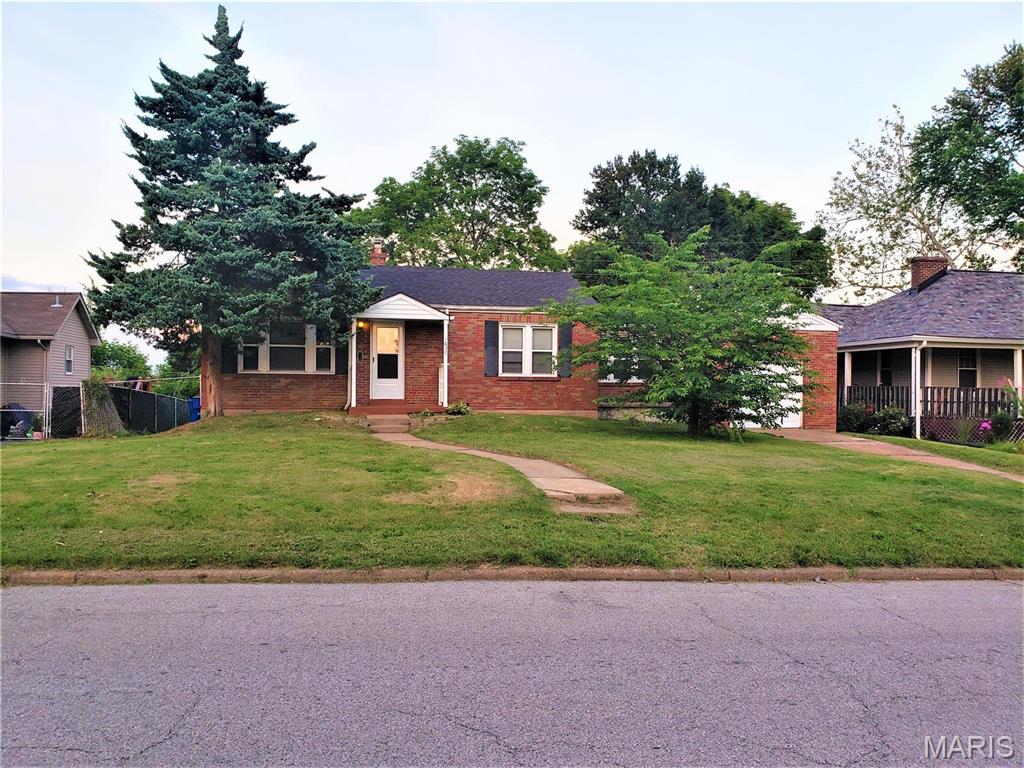 Three bedroom home on a nice quiet U City street.  Wood floors throughout this spacious home.  Updated kitchen.  Large backyard backs to trees.  Unfinished walkout basement.  1 Car Attached Garage.  Great Neighborhood in excellent location, close to shopping and highways.  No pets please.