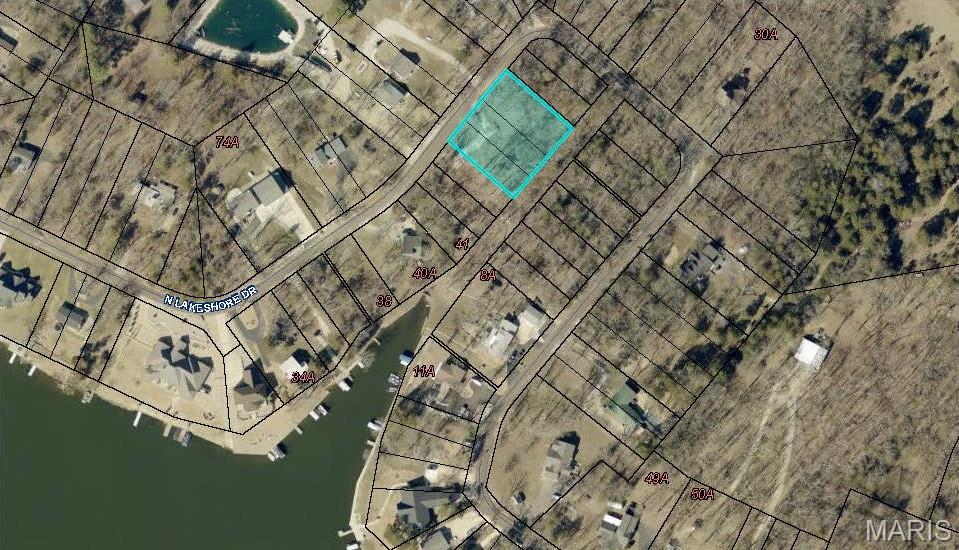 Rare 1.02-acre vacant building lot in Lake Tishomingo! Five connecting lots offer plenty of room to create your dream home in a beautiful lake community. Property features a cleared potential homesite, mature trees, wooded areas, gentle rolling terrain, and picturesque lake views. Enjoy access to the many recreational opportunities Lake Tishomingo offers, including fishing, boating, swimming, and clubhouse amenities. A 40-foot easement along the bottom of the property provides walkable access toward the lake. Single-family zoning and electricity available.  A great opportunity to build now or invest for the future! Bring your vision and start planning your lake-area retreat! Sellers are leaving the boat!
Buyer to verify all utilities, building requirements, restrictions, easements, and suitability for intended use.