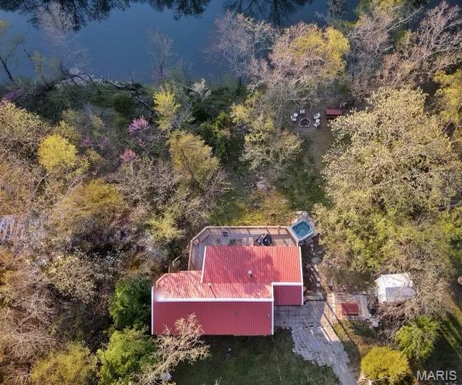 Charming Riverfront Cabin on the St. Francois River.
Beautifully furnished 2-bedroom, 1-bath cabin on a peaceful dead-end road overlooking the scenic St. Francois River. This turn-key property is an active revenue-producing Airbnb or the perfect private getaway. Enjoy stunning river views from the large deck, partially covered for year-round comfort. Relax in the outdoor hot tub or gather around the fire pit under the stars. Inside, you’ll find some hardwood floors, plenty of river-facing windows, and a clawfoot soaking tub in the master bedroom. The low-maintenance yard means more time to enjoy nature. The St. Francois River offers amazing kayaking, canoeing, and fishing, making this property ideal for outdoor enthusiasts. The can furniture stay, making it completely move-in ready. Whether you’re looking for a serene getaway, a full-time home, or an income-producing vacation rental, this cabin delivers comfort, charm, and natural beauty in one perfect river front package.  Also Elephant Rocks, Mill Stream Gardens, Silver Mines, Taum Sauk Mountain, and Johnson Shut-ins are all just a short drive for your outdoors adventures!