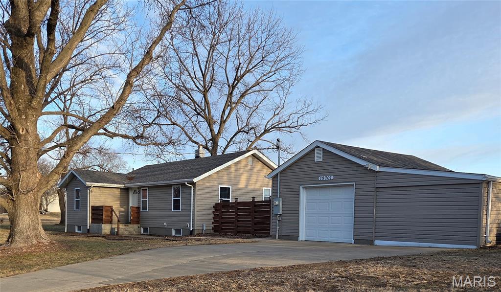 This well maintained beautiful bungalow is perched on 2 sprawling acres! You enter into a large living room with tons of natural inviting light.  The three bedrooms and full bathroom are easily accessible from the heart of the home.  The eat-in kitchen offers plenty of cabinets for storage and counter space galore! A quick trip downstairs to the walkout basement where your creativity can soar, as well as additional storage.  The exterior provides a large deck that is perfect for entertaining, also allowing perfect views to the fruit orchard.  Detached, oversized 1 car garage with an attached 200 sq. ft. shed.  This property offers all of the modern day amenities while living in a country setting. Enjoy nature's free entertainment of the deer galloping through the property along the cute sightings of a fox or two!  Some of the recent updates include a roof, septic tank/system. So many options to live and run a small business from home, or add stables to create an equestrian home for a couple of horses. Nearby, you will find tons of shopping, plenty of parks, libraries, and healthcare facilities.  Schedule your appointment to view serenity and a piece of paradise with your favorite Realtor today!