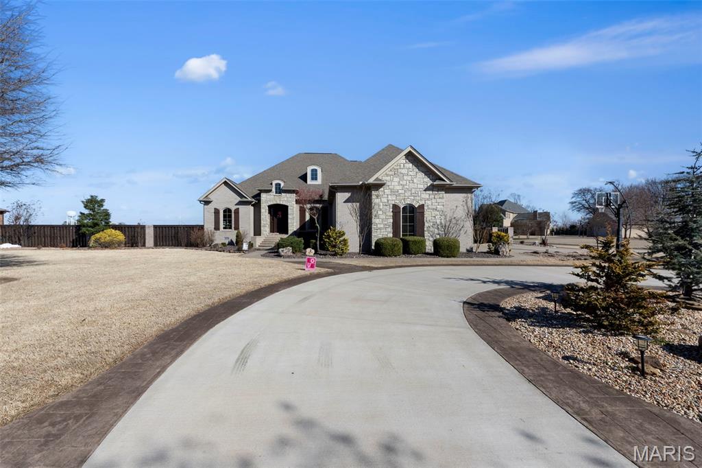 Luxury home located in the desirable Greenfield Subdivision! This stunning property offers 5 bedrooms and 4.5 bathrooms and sits on a nearly half-acre corner lot. The main level features 4 spacious bedrooms and 3.5 bathrooms, including an oversized primary suite filled with natural light from large windows. The primary bathroom offers double vanities and a huge walk-in shower. The main floor provides plenty of living and dining space with both a formal dining room and an additional dining area located just off the kitchen. The kitchen is a must-see with custom cabinetry, built-in appliances, and a large cooking surface perfect for preparing meals and entertaining. Two bedrooms share a convenient Jack-and-Jill bathroom, while the fourth bedroom has its own private bath. A half bath is located in the hallway for guests. The utility room includes extensive cabinet storage and a sink, and there is also a dedicated office that could easily serve as a nursery or additional bedroom. Upstairs you will find an impressive at-home movie theater complete with a large screen, projector, and comfortable seating—perfect for entertaining or enjoying your favorite films. The upper level also features a huge bonus room that has been recently updated, along with an additional bedroom and full bathroom. The exterior of this home is equally impressive. The meticulously maintained backyard is designed for entertaining and relaxation, featuring a large swimming pool with diving board, tanning areas, and a spacious patio and grilling area. An oversized 3-car garage, large driveway, and circle drive provide plenty of parking space. Built in 2013, this exceptional home has been well maintained and offers numerous updates throughout. Don’t miss your opportunity to own this incredible property in the Greenfield Subdivision!