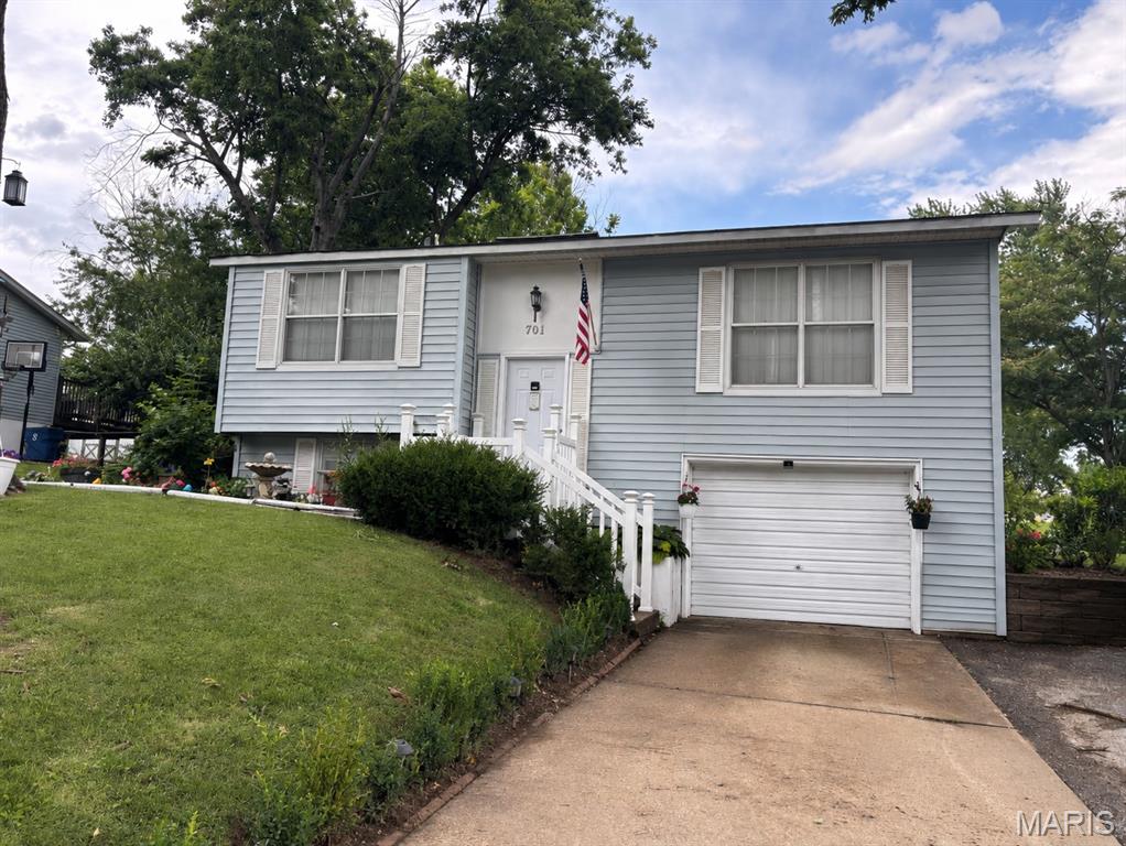 A solid home  ready for your touch and make-over.  3 bedroom, 1 bath, split foyer, eat in kitchen, bonus room in the basement along with laundry area.  Large Corner lot with fenced in back yard with lots of perennials and fruit trees.  1 Car garage with additional parking next to drive way. Selling AS IS, but a solid home.