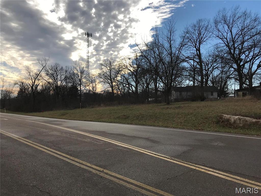 Awesome location with 630' of road frontage on the Eastern Outer Road!  Great area for any type of commercial business. There is 519' of frontage on Eagle Lane as well, which would make a perfect back/truck entrance for a commercial venture. There are two houses that are rented, a priceless old barn and several other outbuildings currently located on this beautiful property. The property is being sold for commercial purposes, but is also a wonderful residential/investment property as well. A perfect piece of property with so many options! Very desirable location …. Check it out! Location: High Traffic, Other